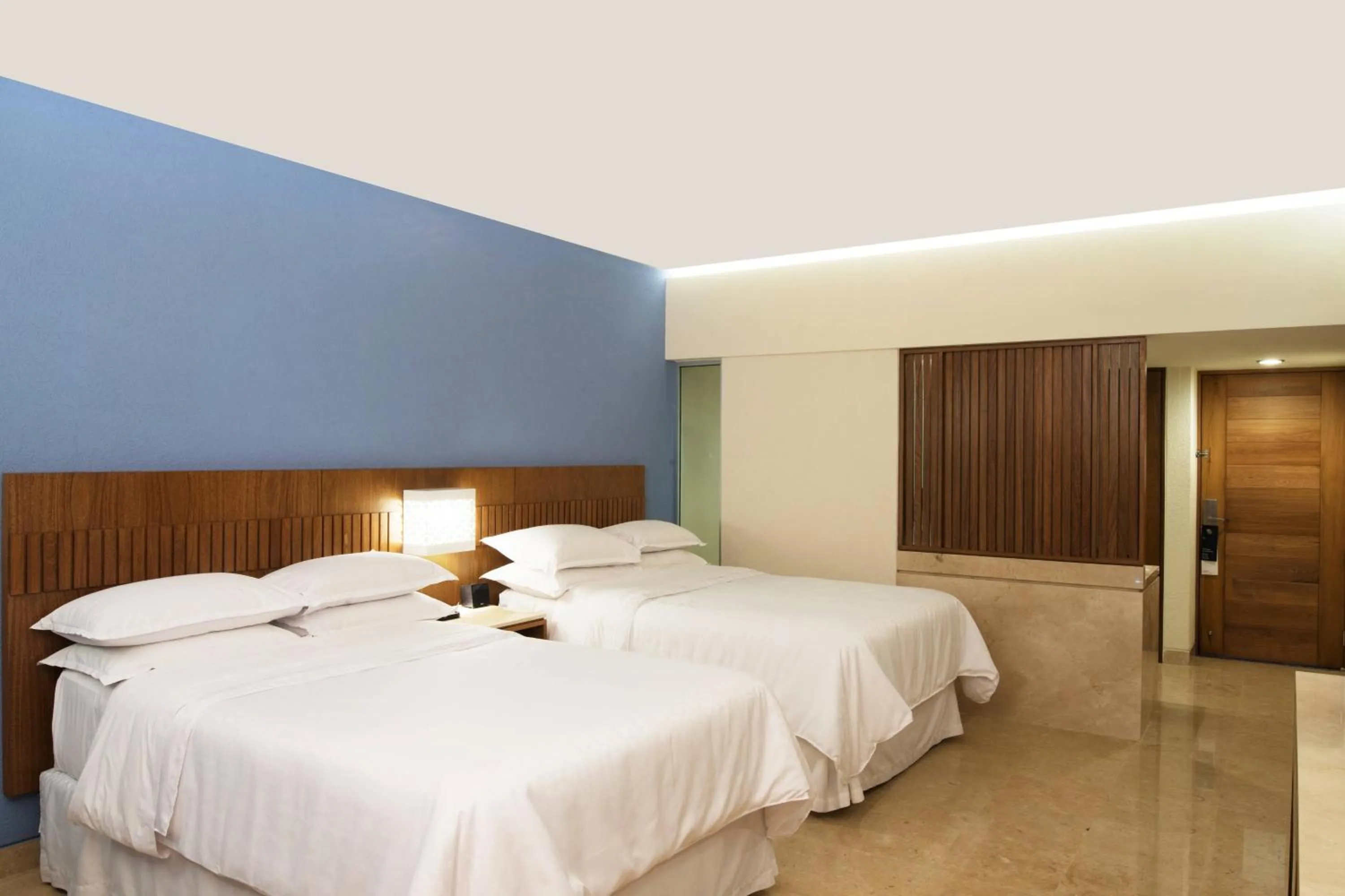 Photo of the whole room, Bed in Sheraton Buganvilias Resort & Convention Center