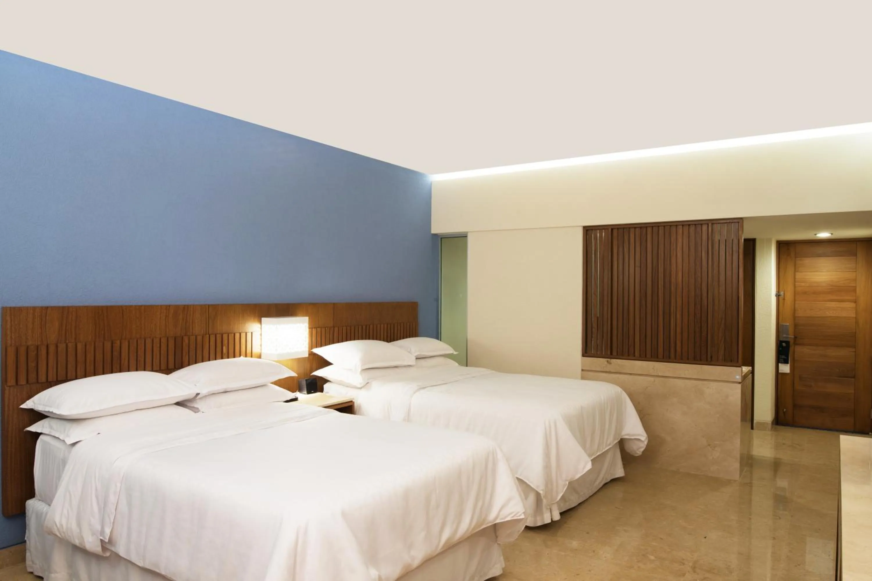 Bed in Sheraton Buganvilias Resort & Convention Center