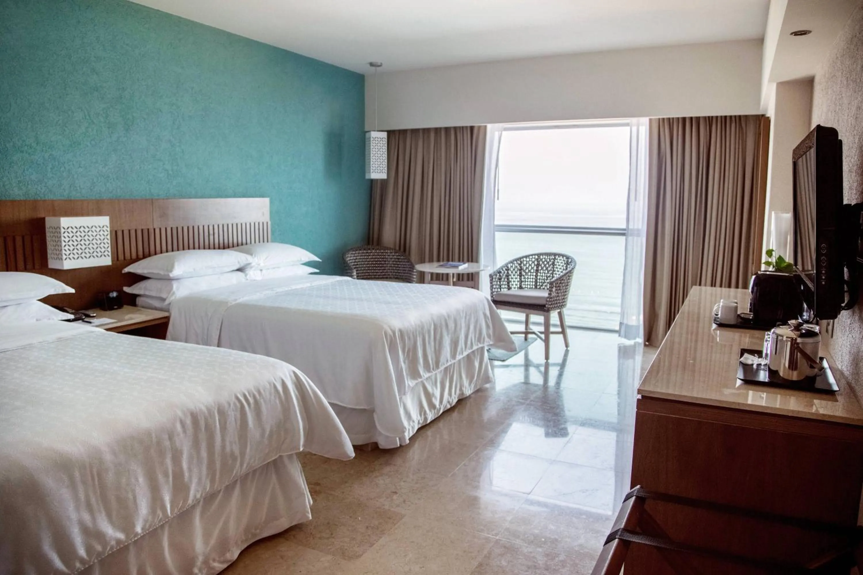 Photo of the whole room, Bed in Sheraton Buganvilias Resort & Convention Center