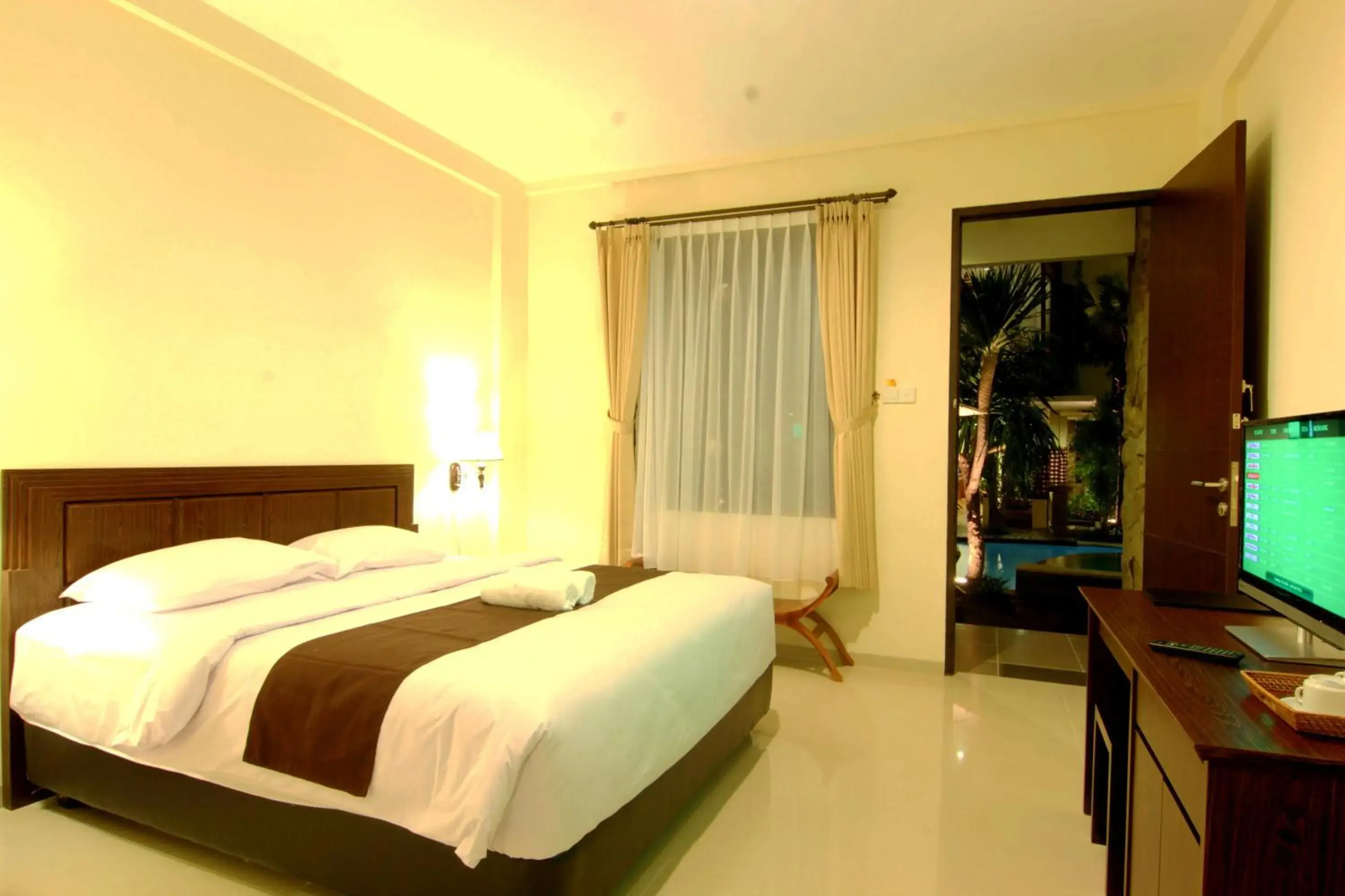 Deluxe Double or Twin Room with Pool View with Free One Way Airport Transfer in Manggar Indonesia Hotel Deluxe Double or Twin Room with Pool View with Free One Way Airport Transfer in Manggar Indonesia Hotel