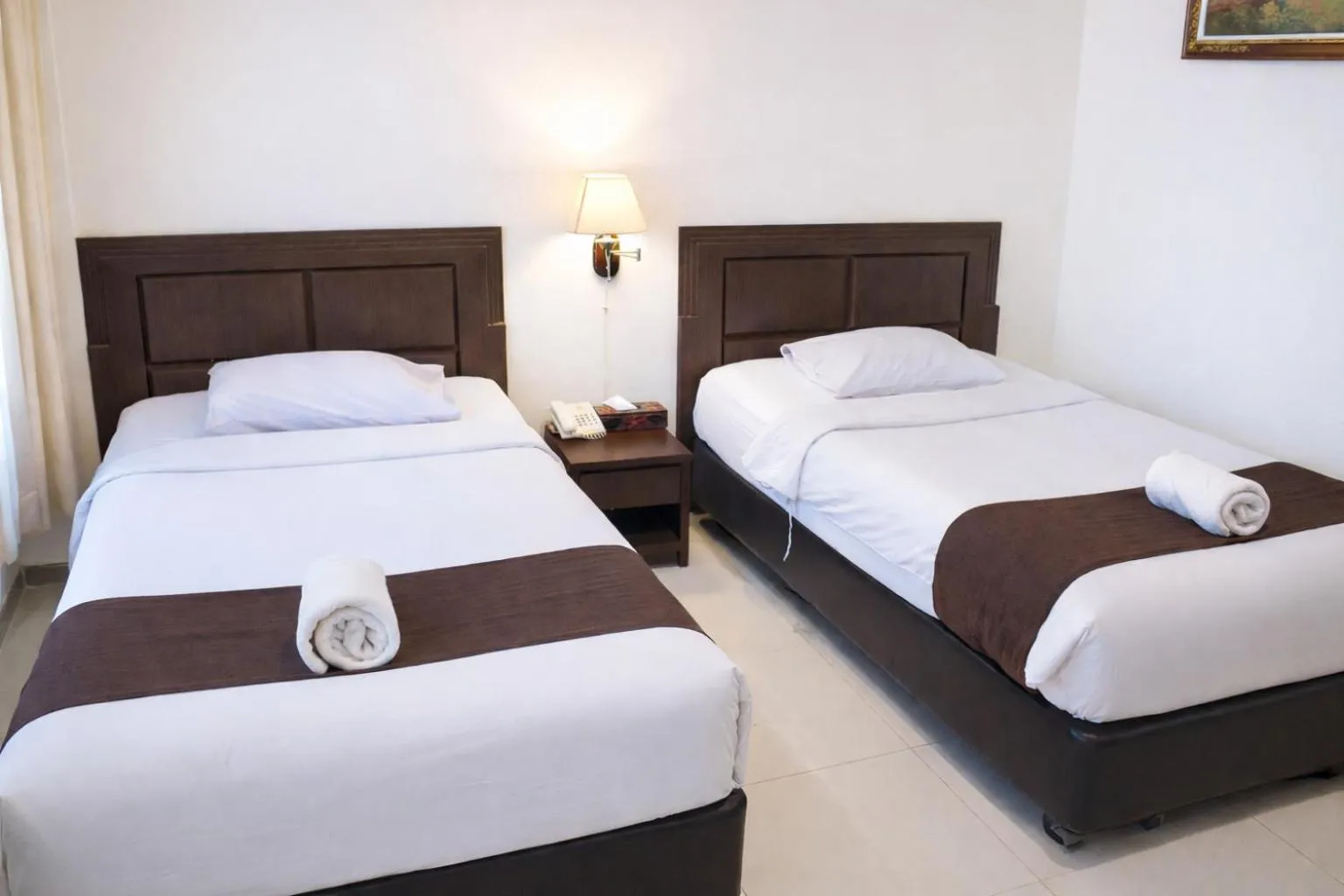 Bed in Manggar Indonesia Hotel