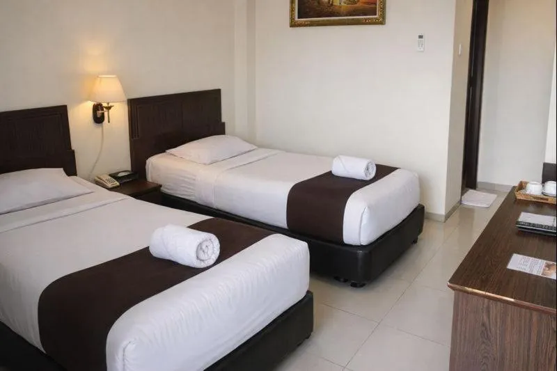 Bed in Manggar Indonesia Hotel