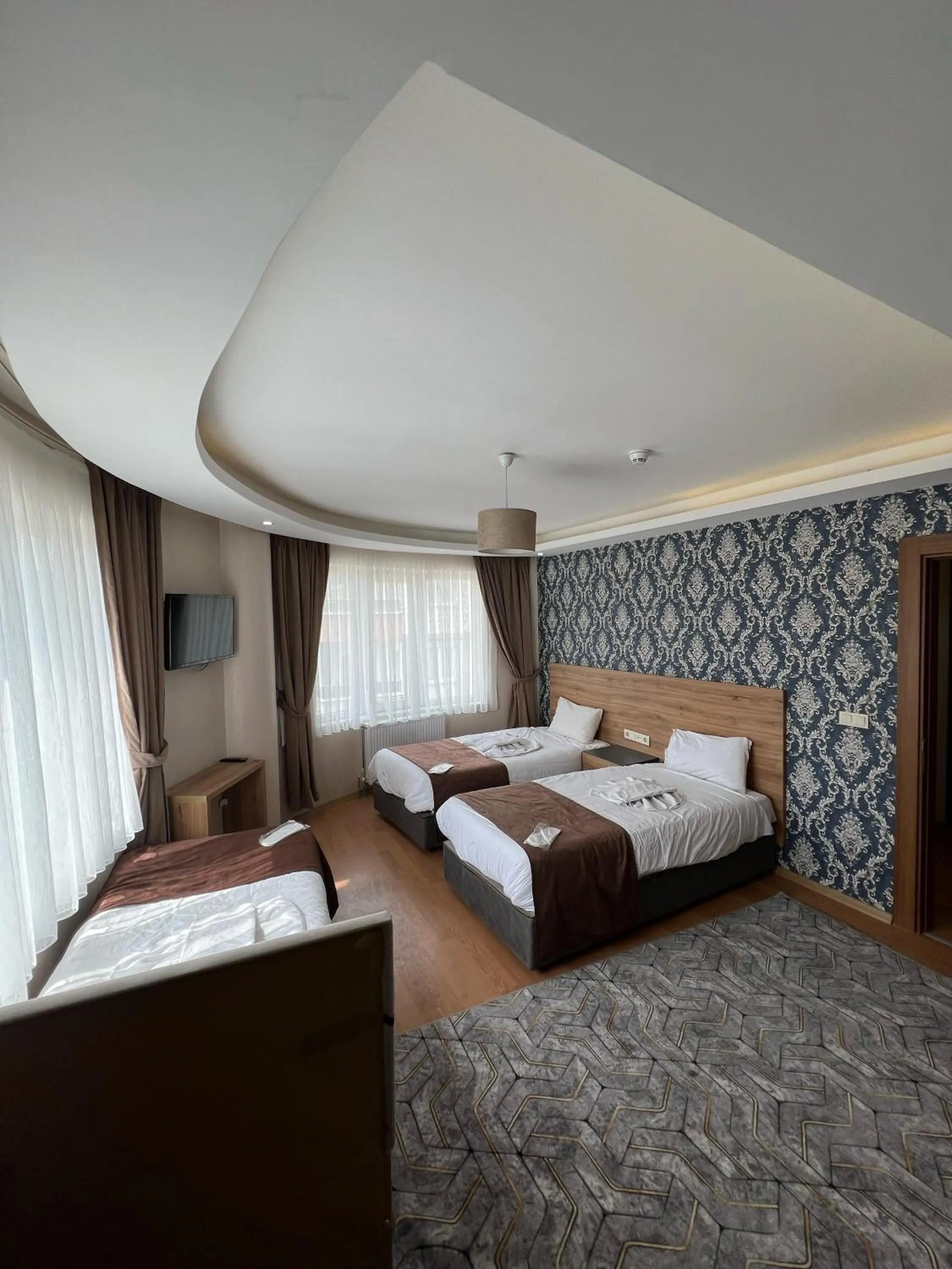 Bed in inDİANA HOTEL