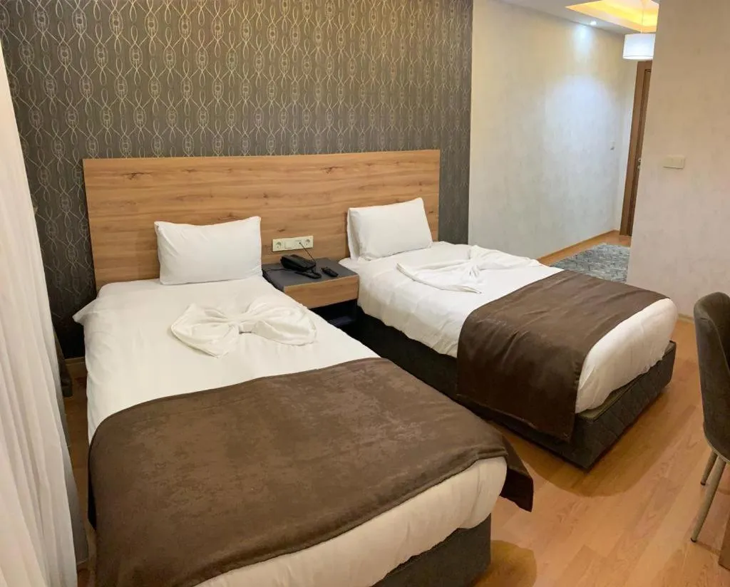 Bed in inDİANA HOTEL