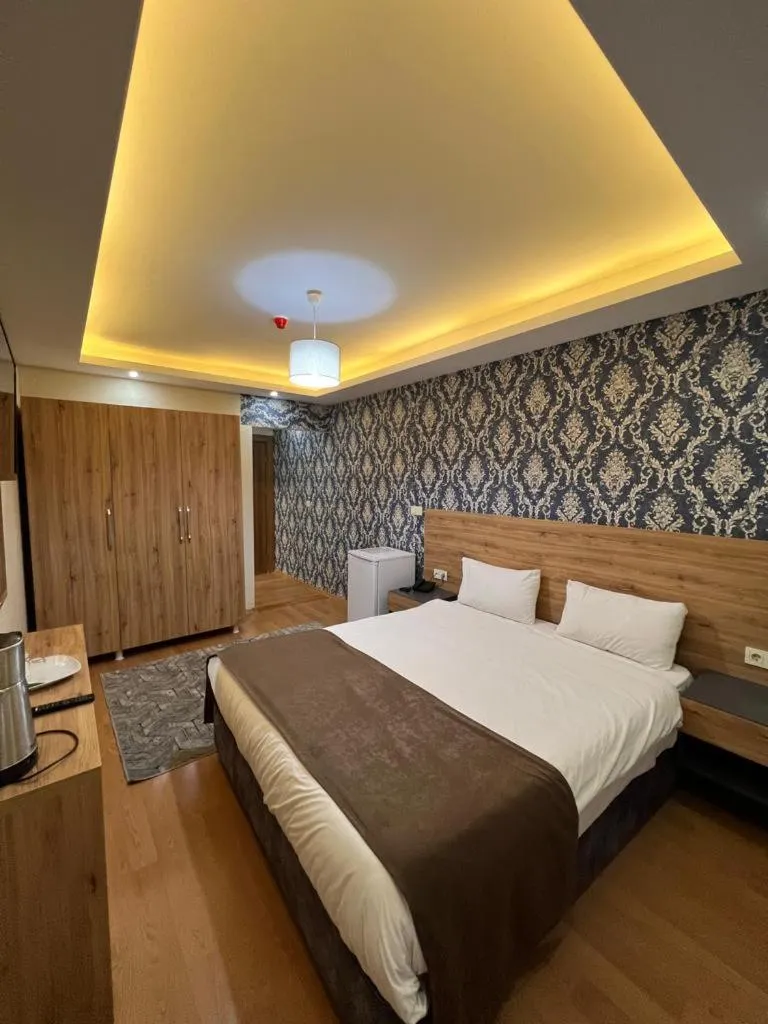 Bed in inDİANA HOTEL