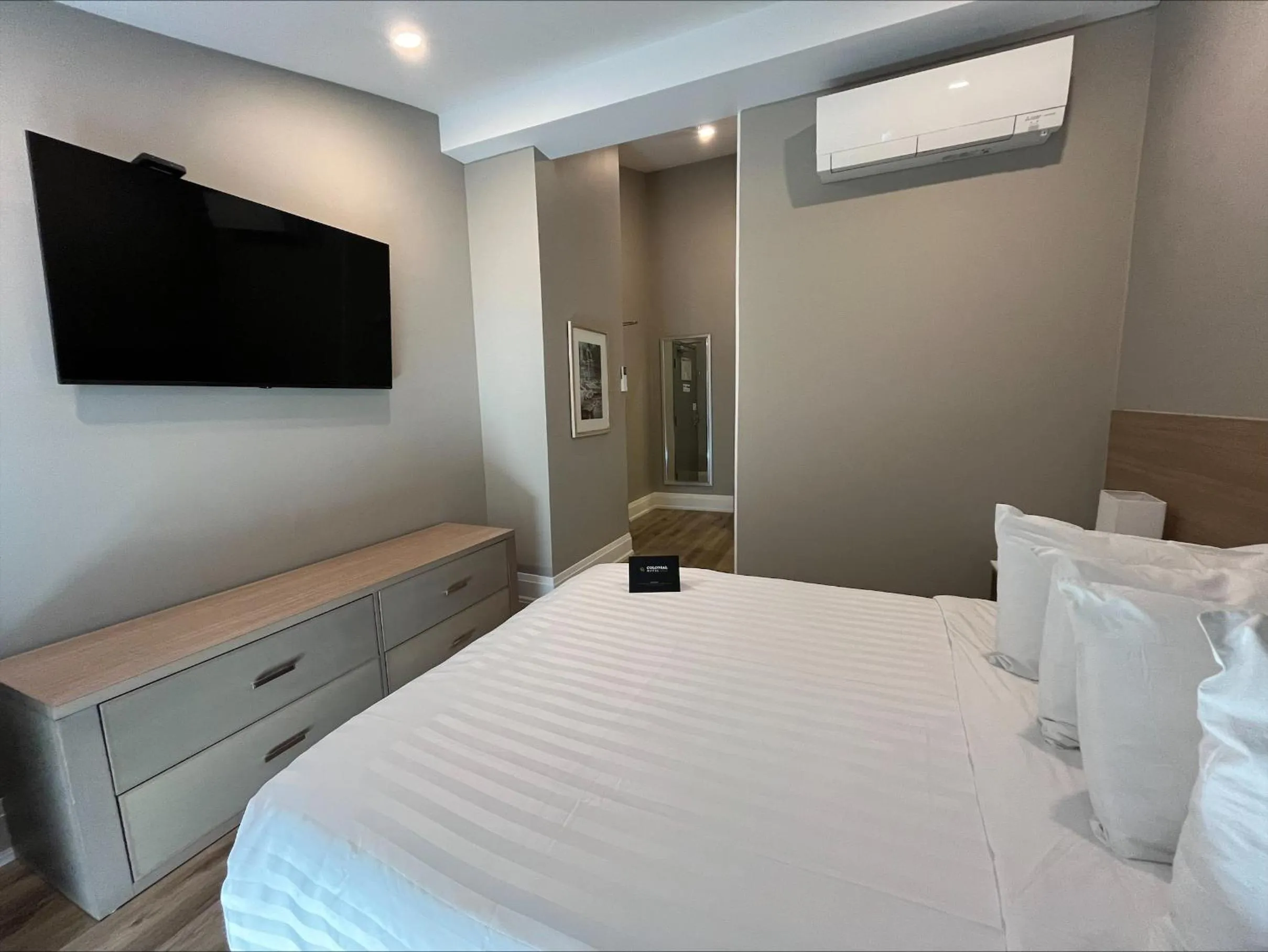 Bed in Colonial Hotel & Suites