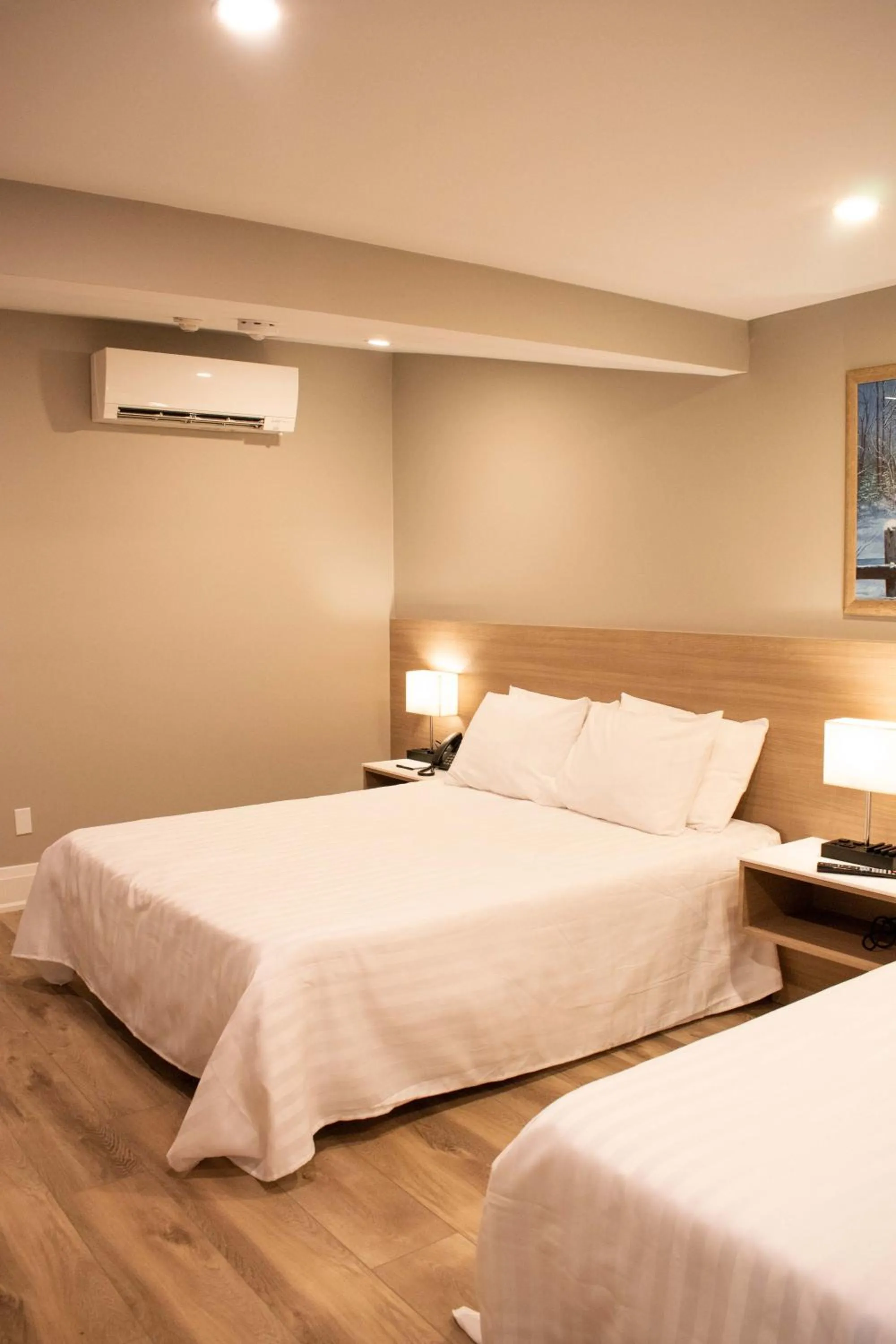 Bed in Colonial Hotel & Suites