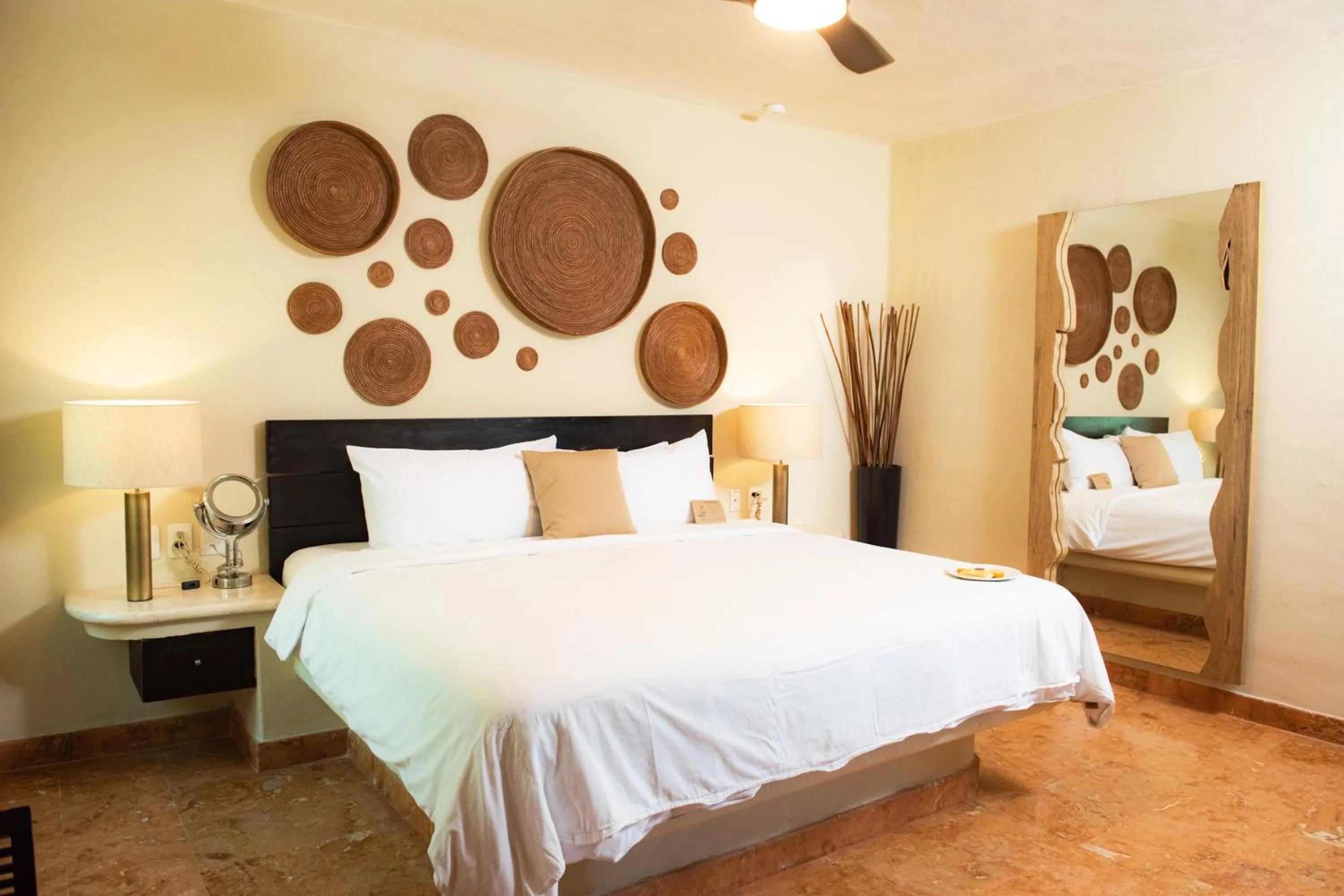 Bed in El Taj Oceanfront and Beachside Condo Hotel