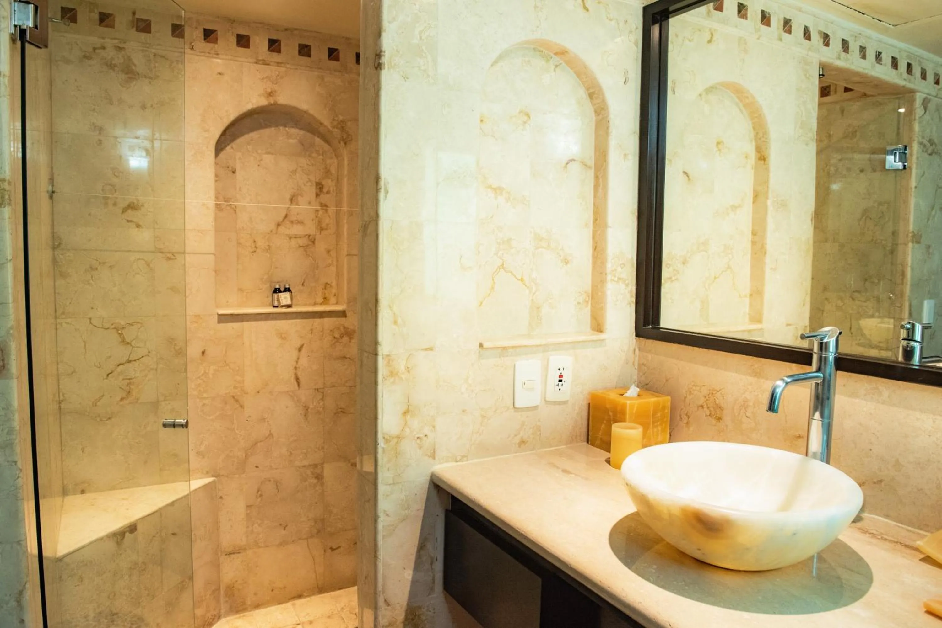 Shower in El Taj Oceanfront and Beachside Condo Hotel