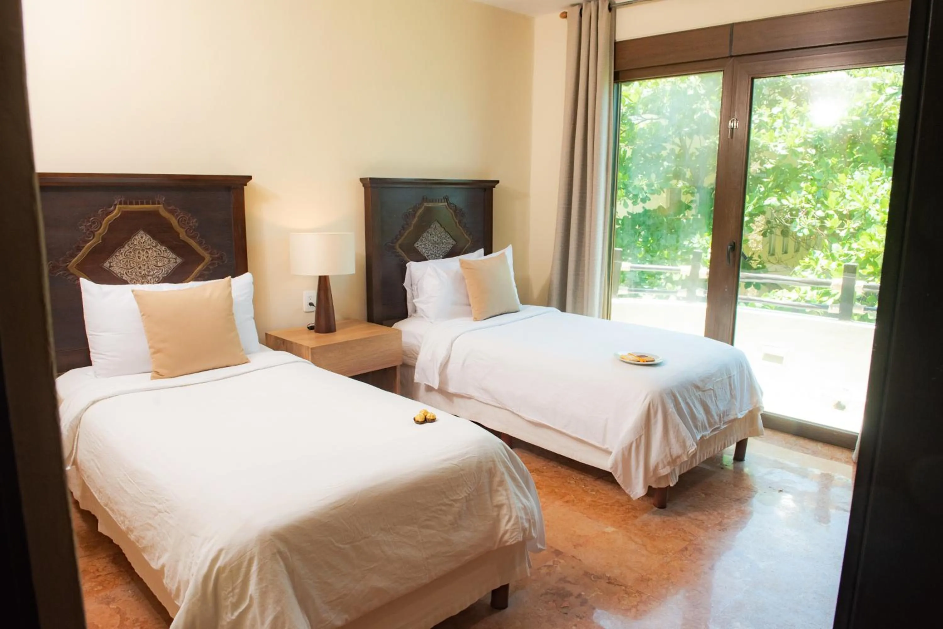 Bed in El Taj Oceanfront and Beachside Condo Hotel