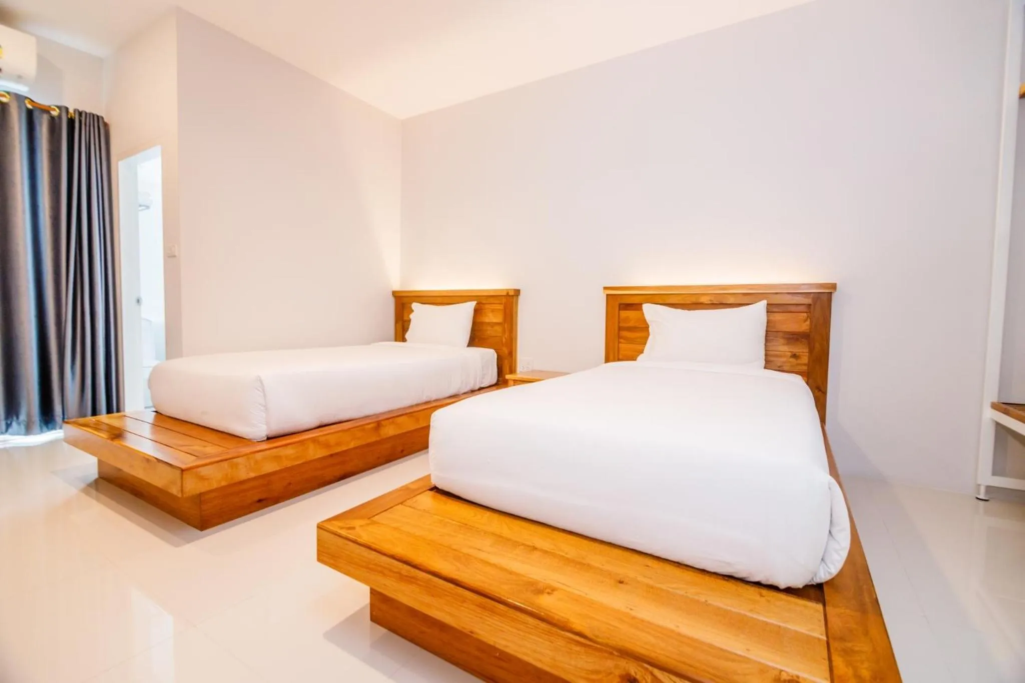 Photo of the whole room, Bed in Greenish Ranong Hotel