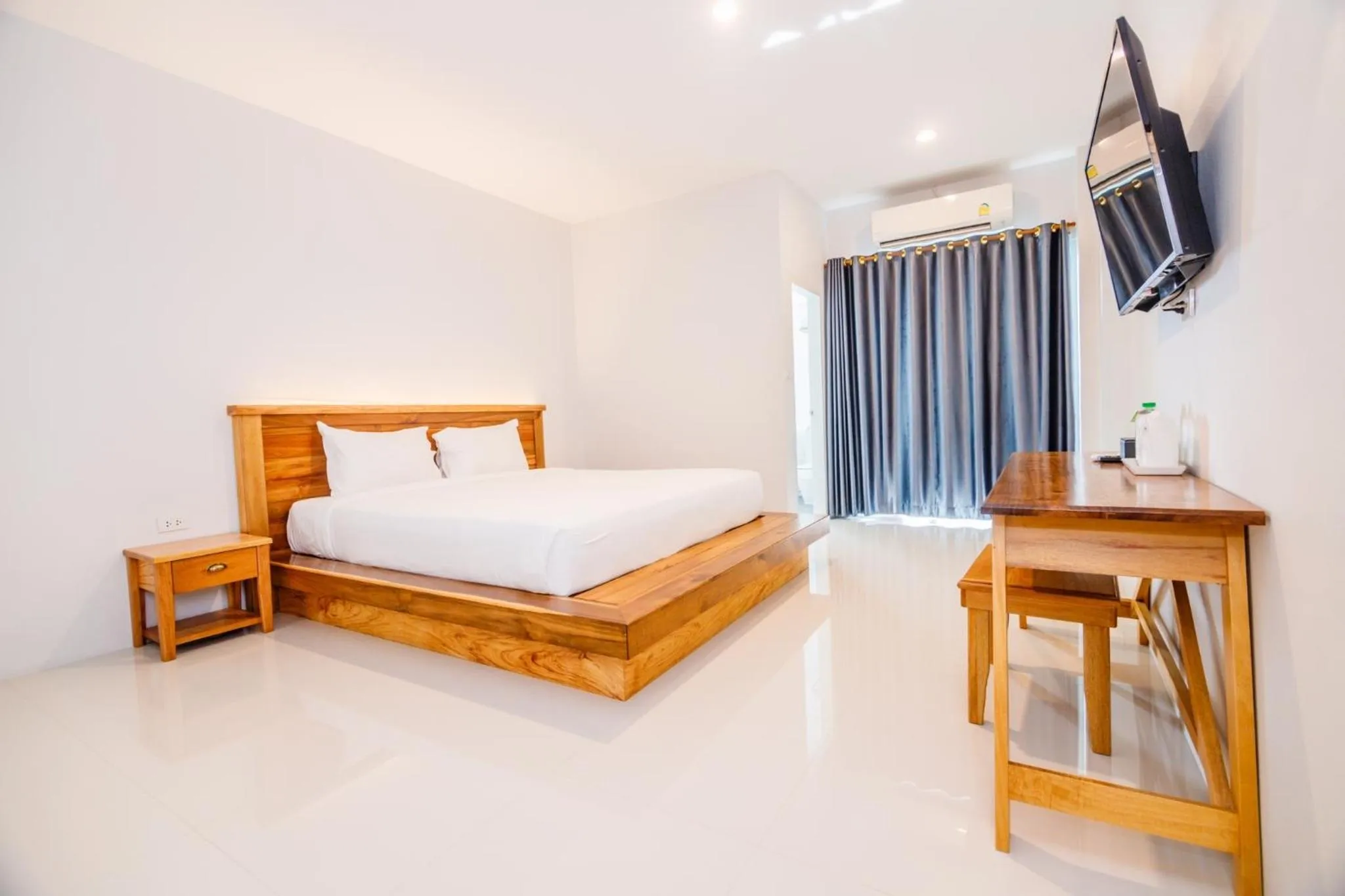 Photo of the whole room, Bed in Greenish Ranong Hotel