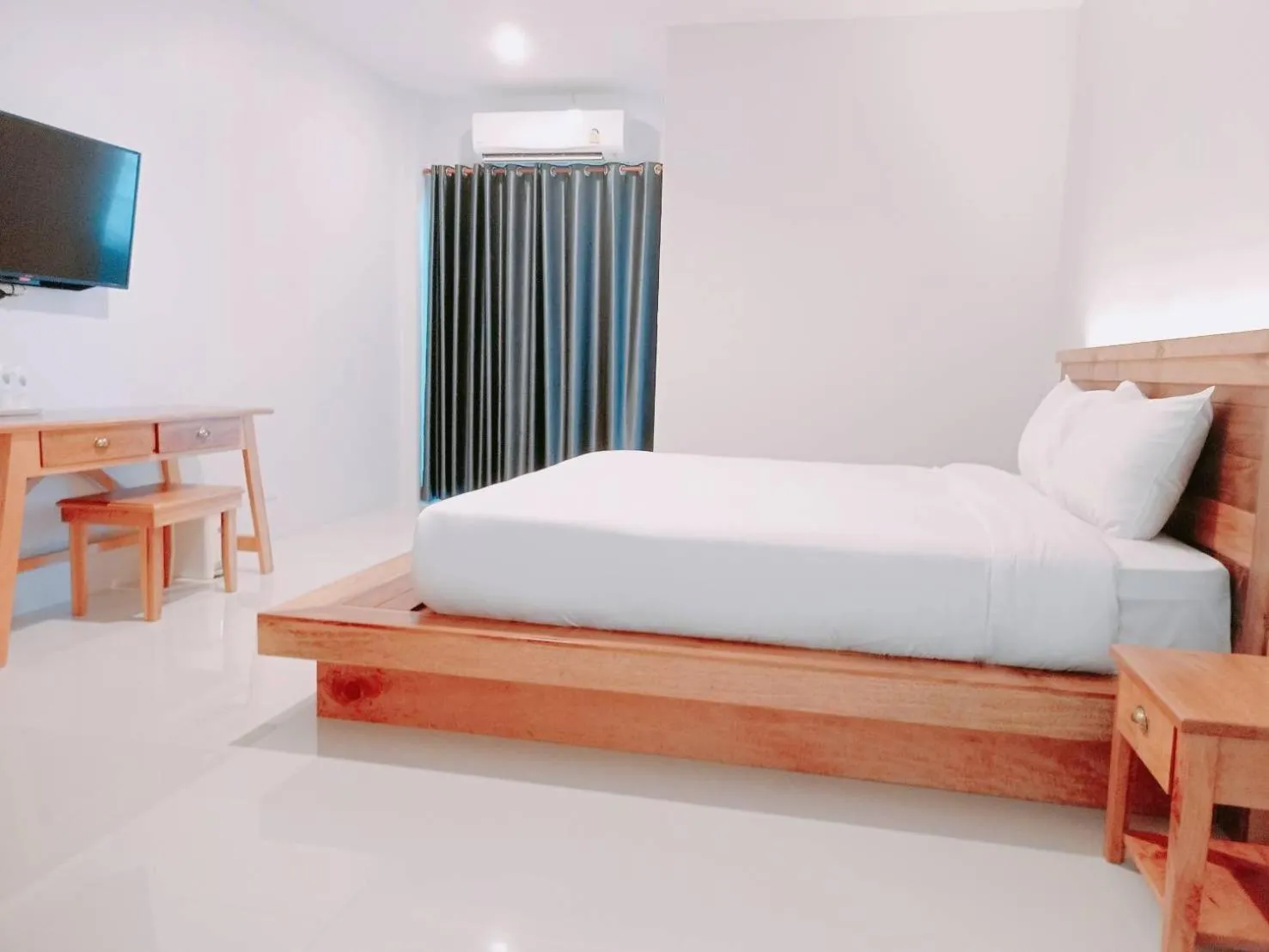 Photo of the whole room, Bed in Greenish Ranong Hotel