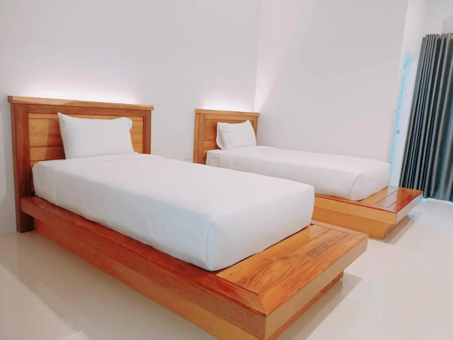 Photo of the whole room, Bed in Greenish Ranong Hotel