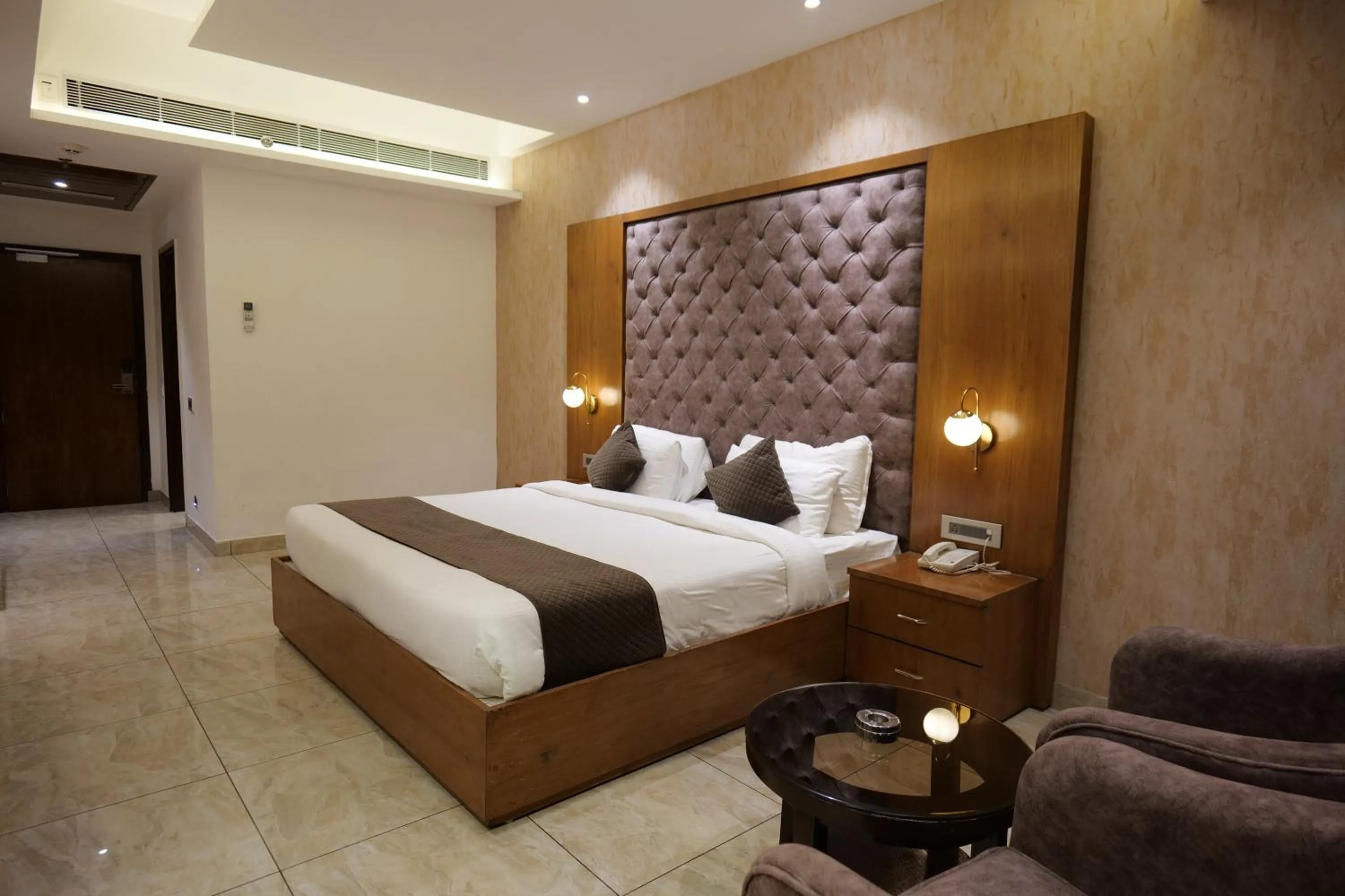 Photo of the whole room, Bed in The Emerald Grand