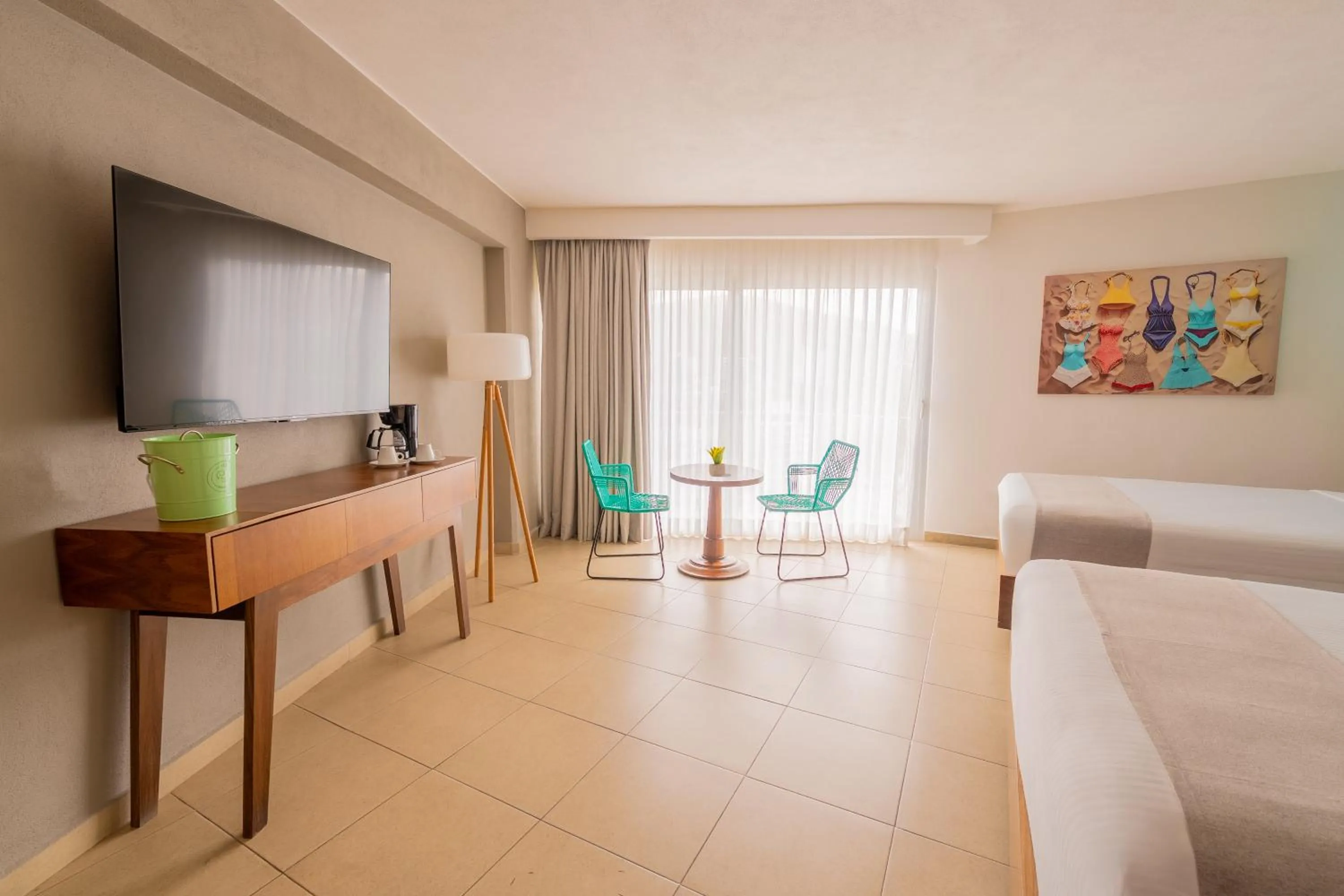 Communal lounge/ TV room in Hotel Amares Acapulco