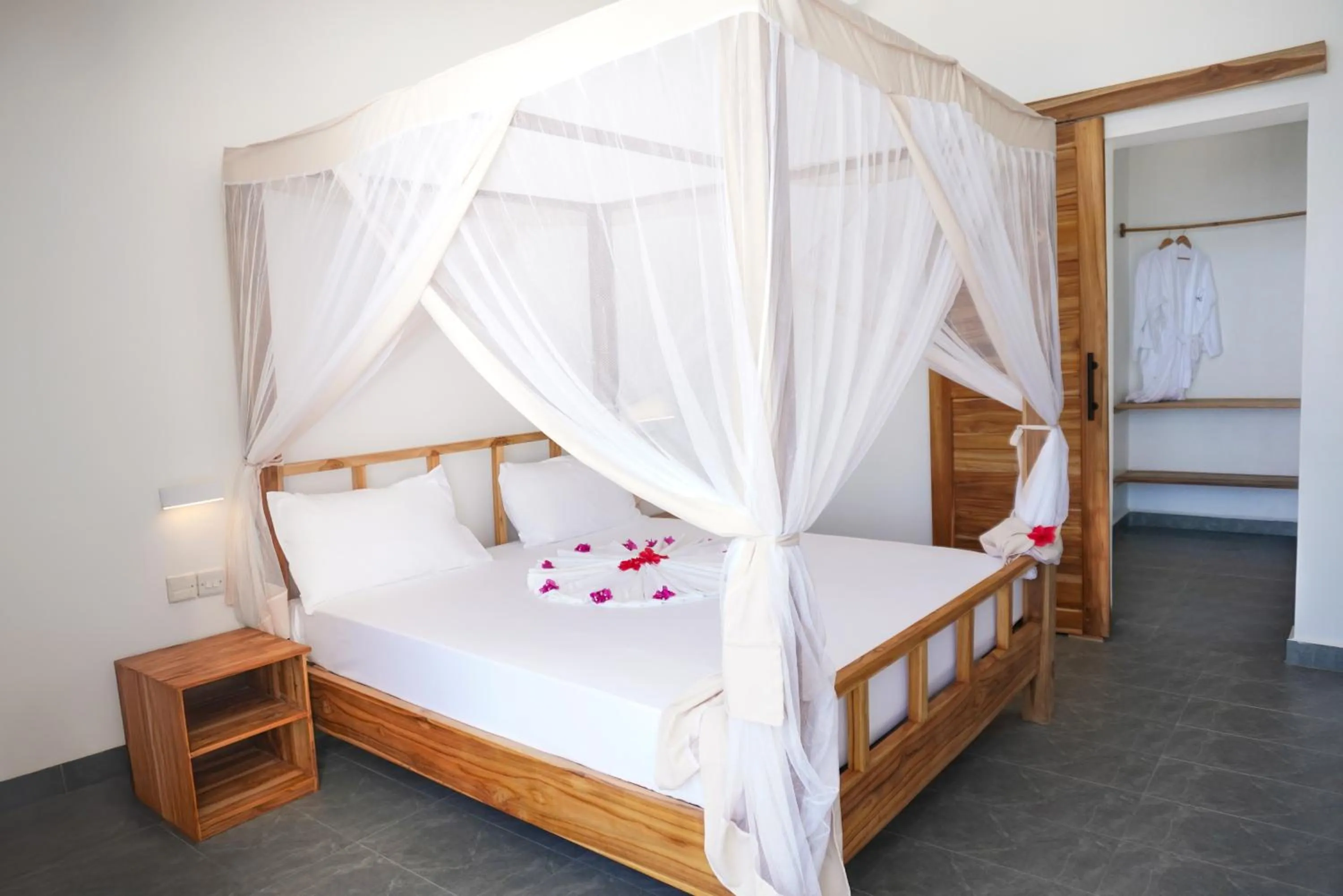 Bed in AHG Sun Bay Mlilile Beach Hotel