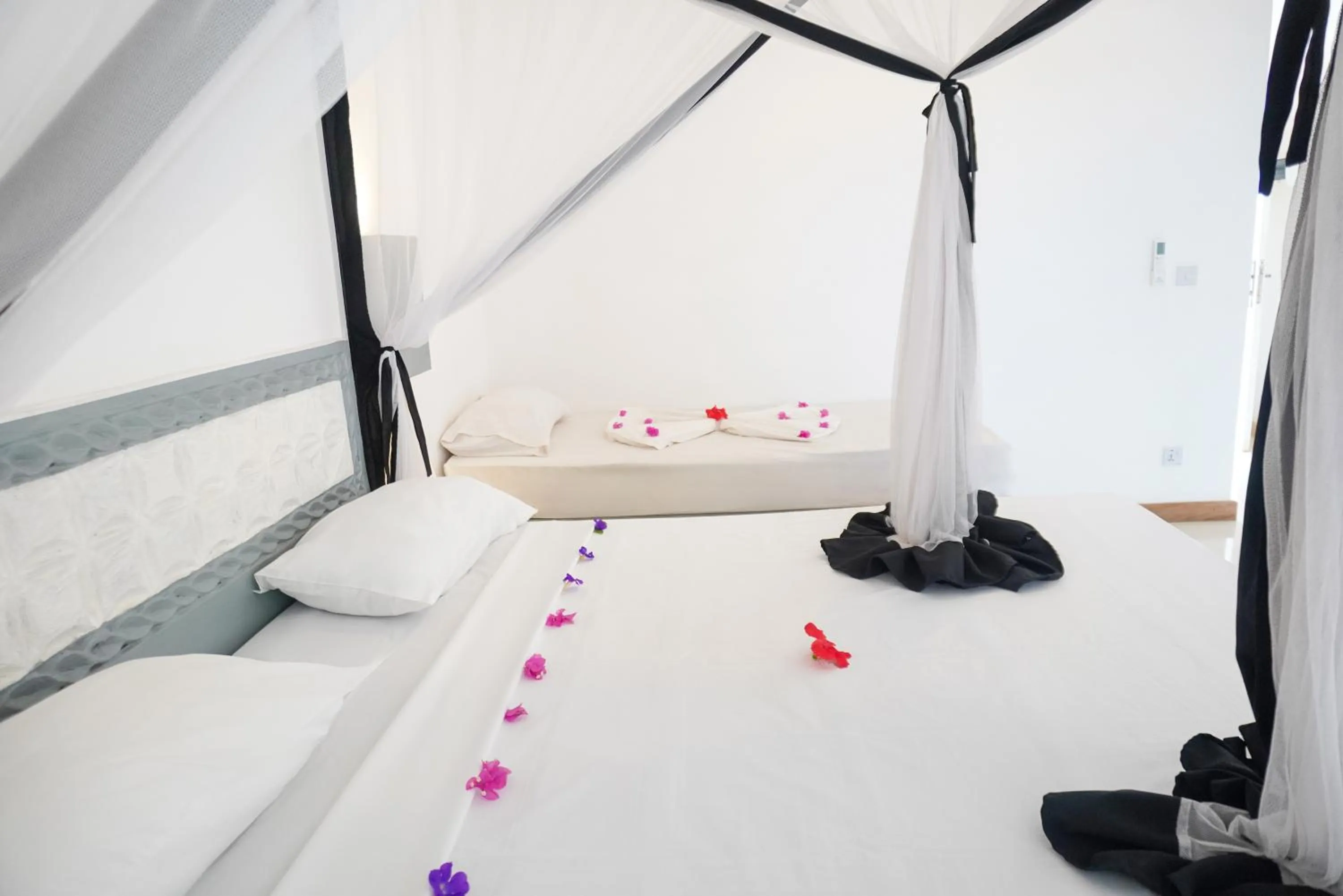 Bed in AHG Sun Bay Mlilile Beach Hotel