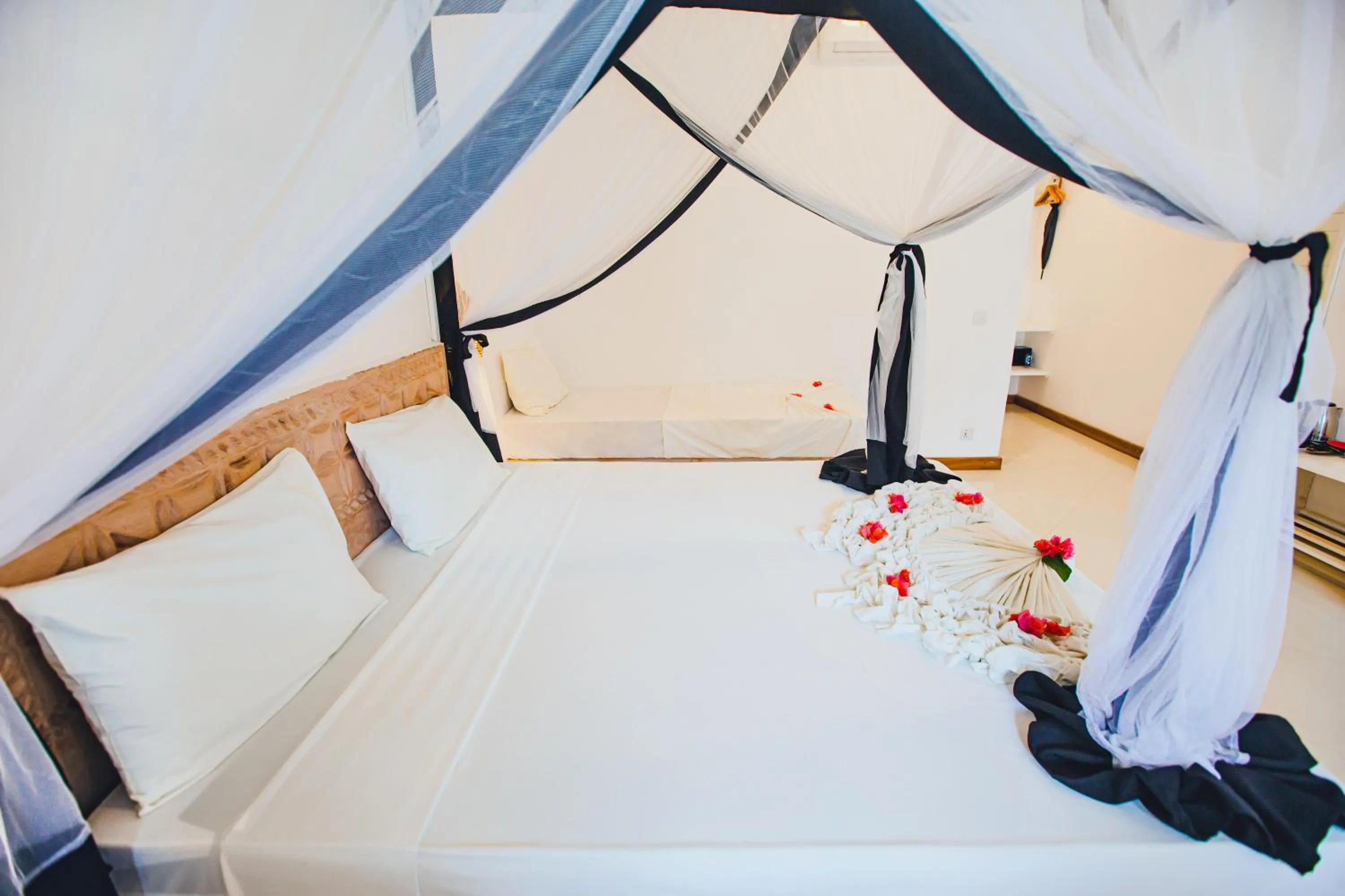 Bed in AHG Sun Bay Mlilile Beach Hotel