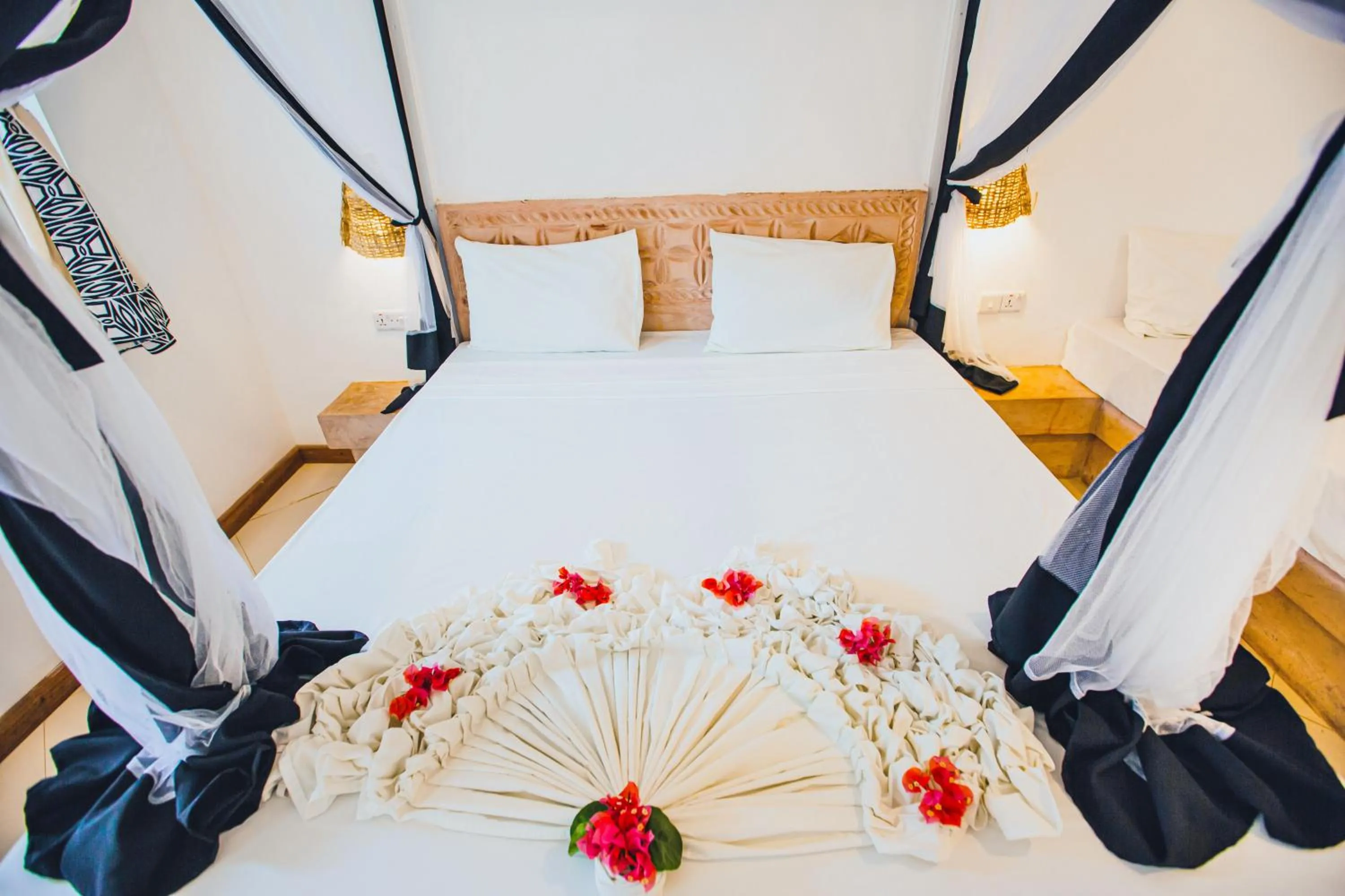 Bed in AHG Sun Bay Mlilile Beach Hotel