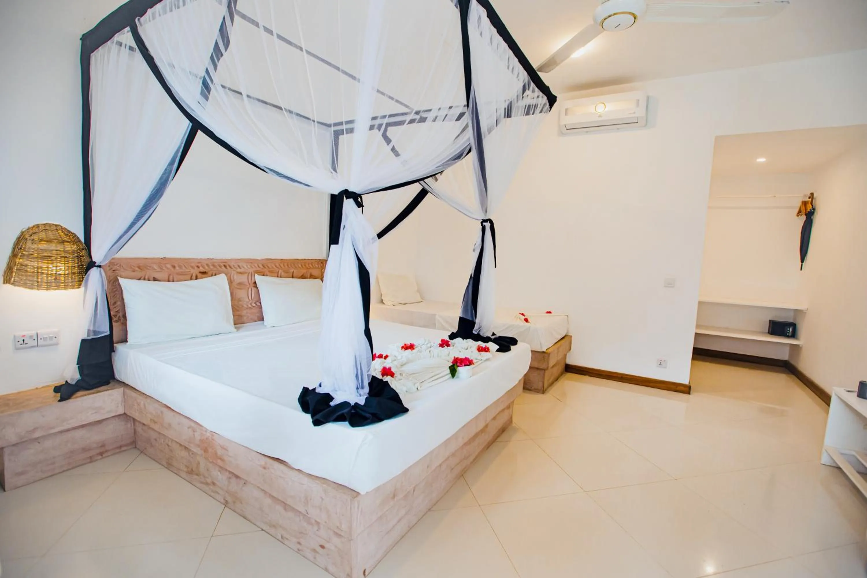 Bed in AHG Sun Bay Mlilile Beach Hotel