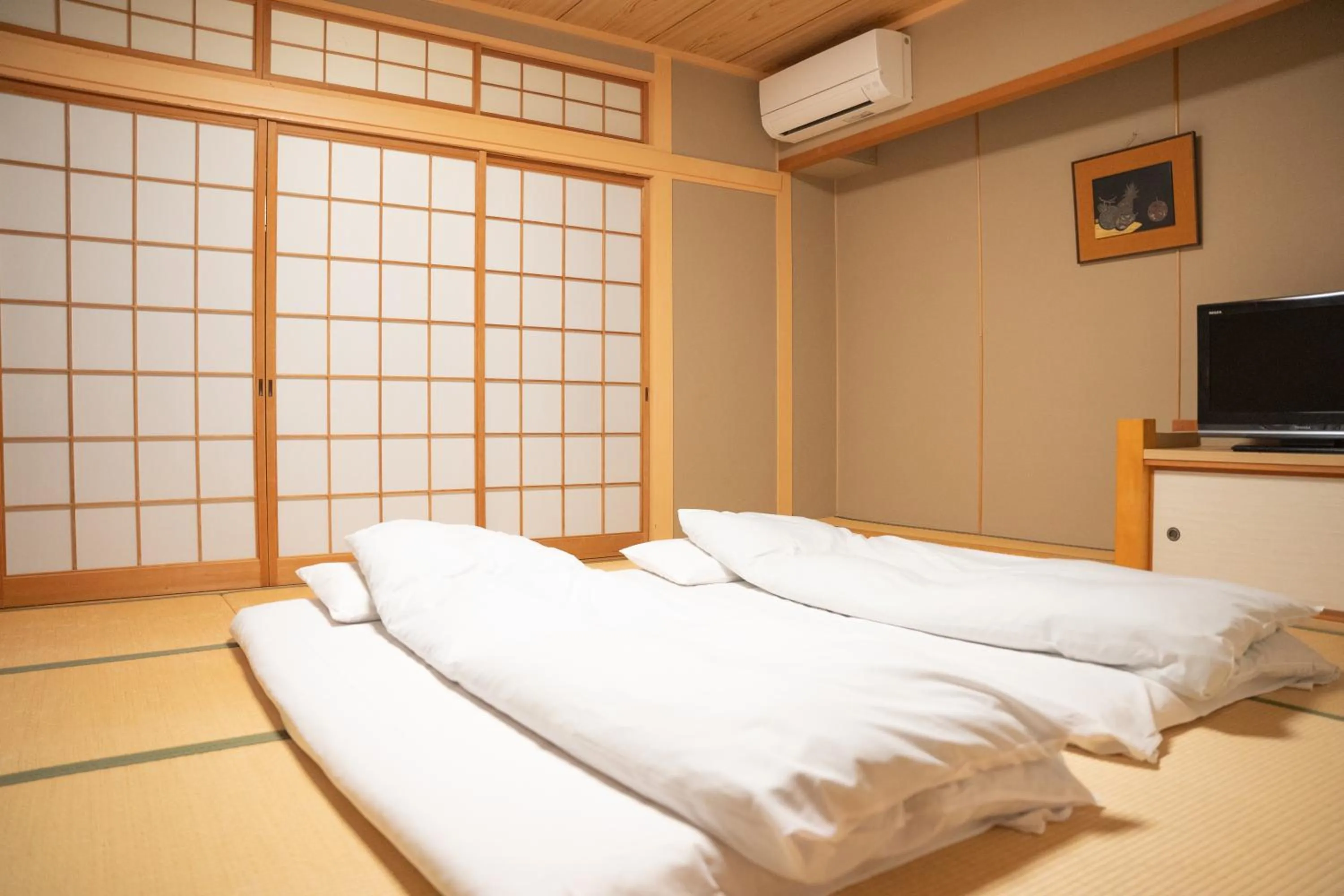 Bedroom, Bed in Yumoto Kanko Hotel Saikyo