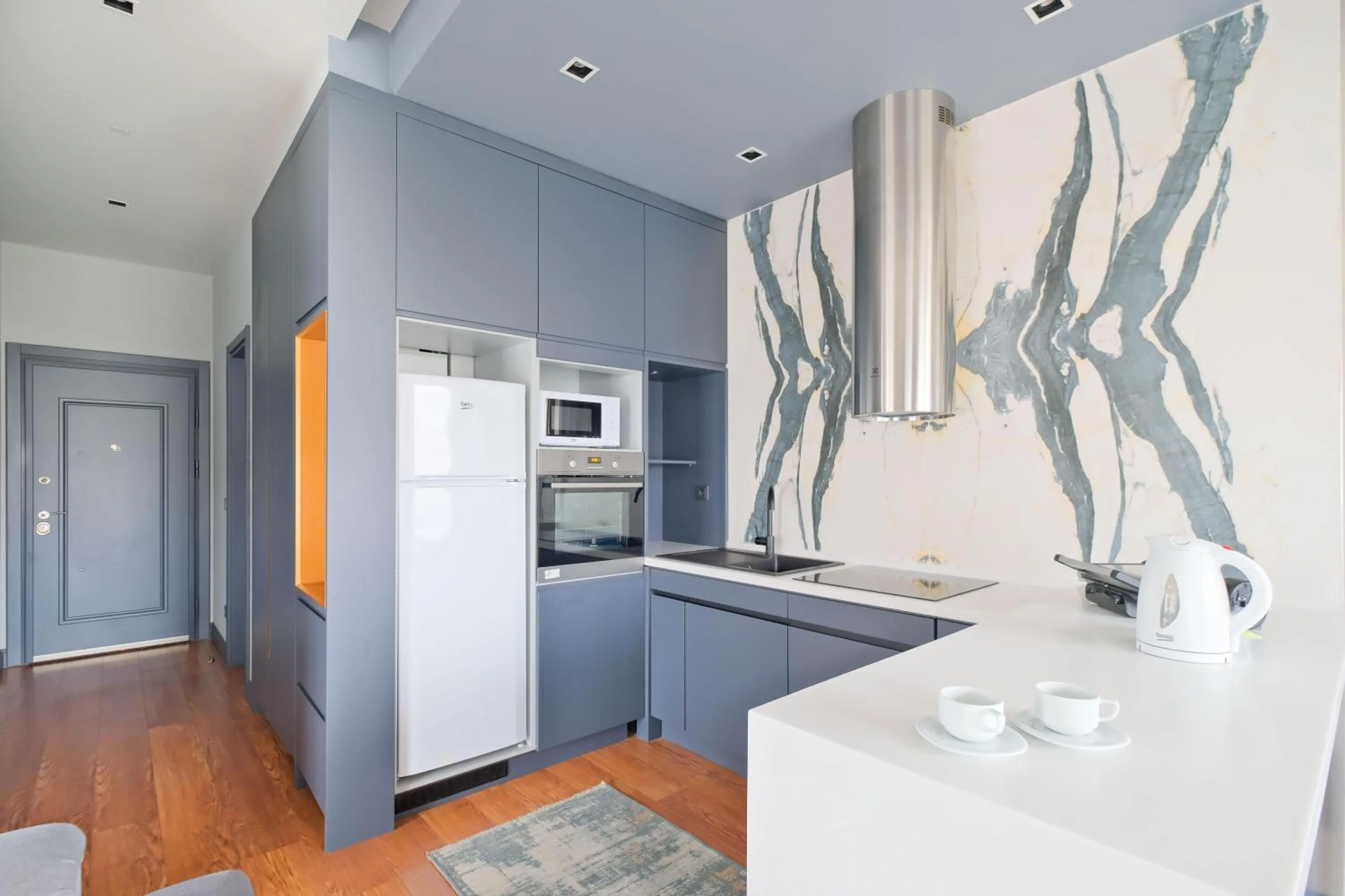 kitchen in Benesta Residence by NewInn