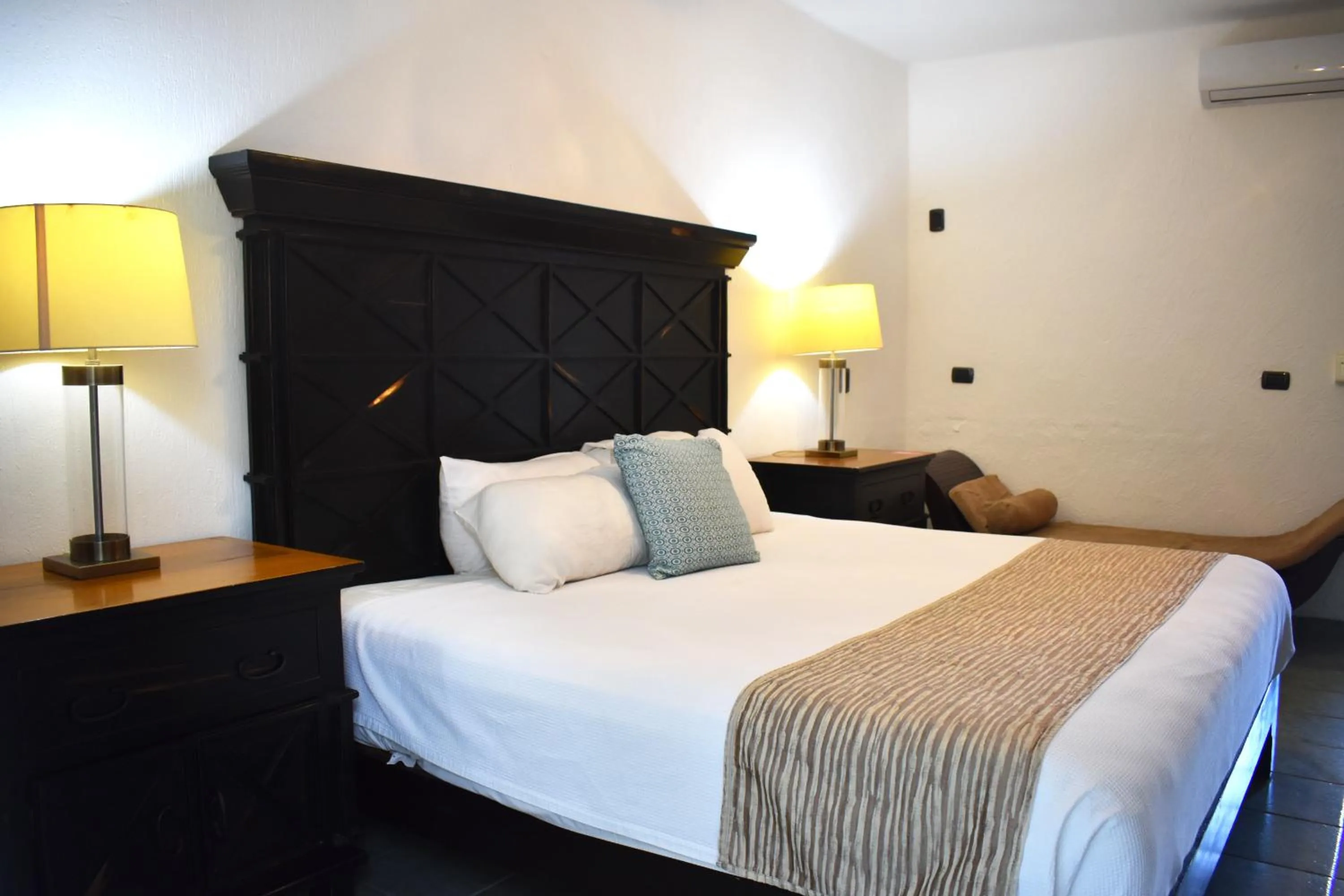 Bed in Hacienda Paradise Hotel