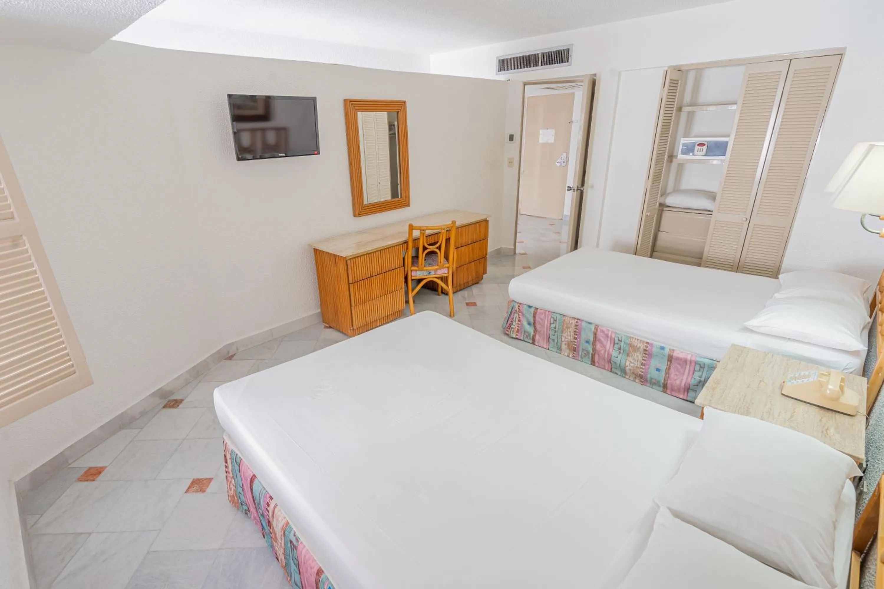 Bed in Playa Suites Acapulco