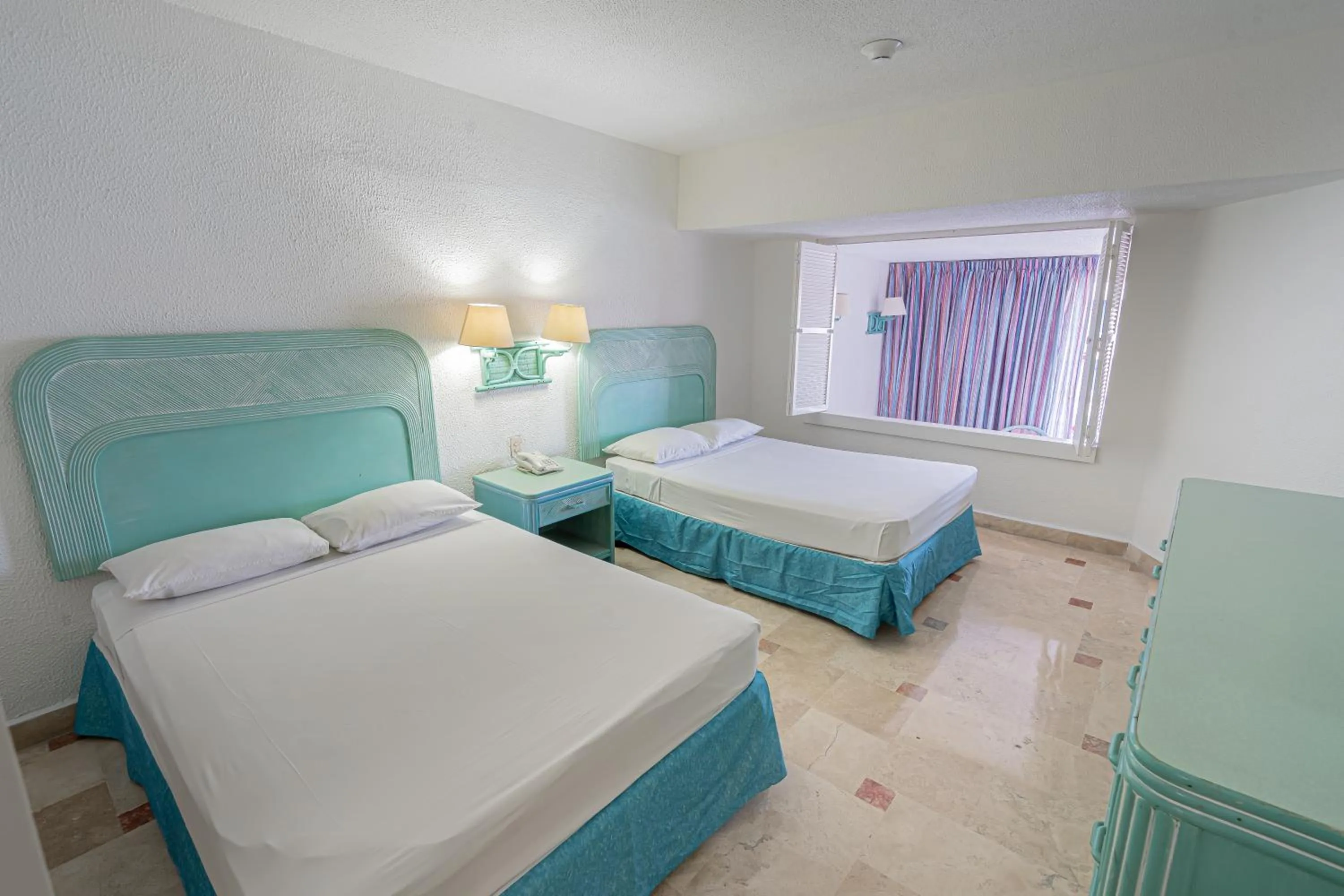 Bed in Playa Suites Acapulco