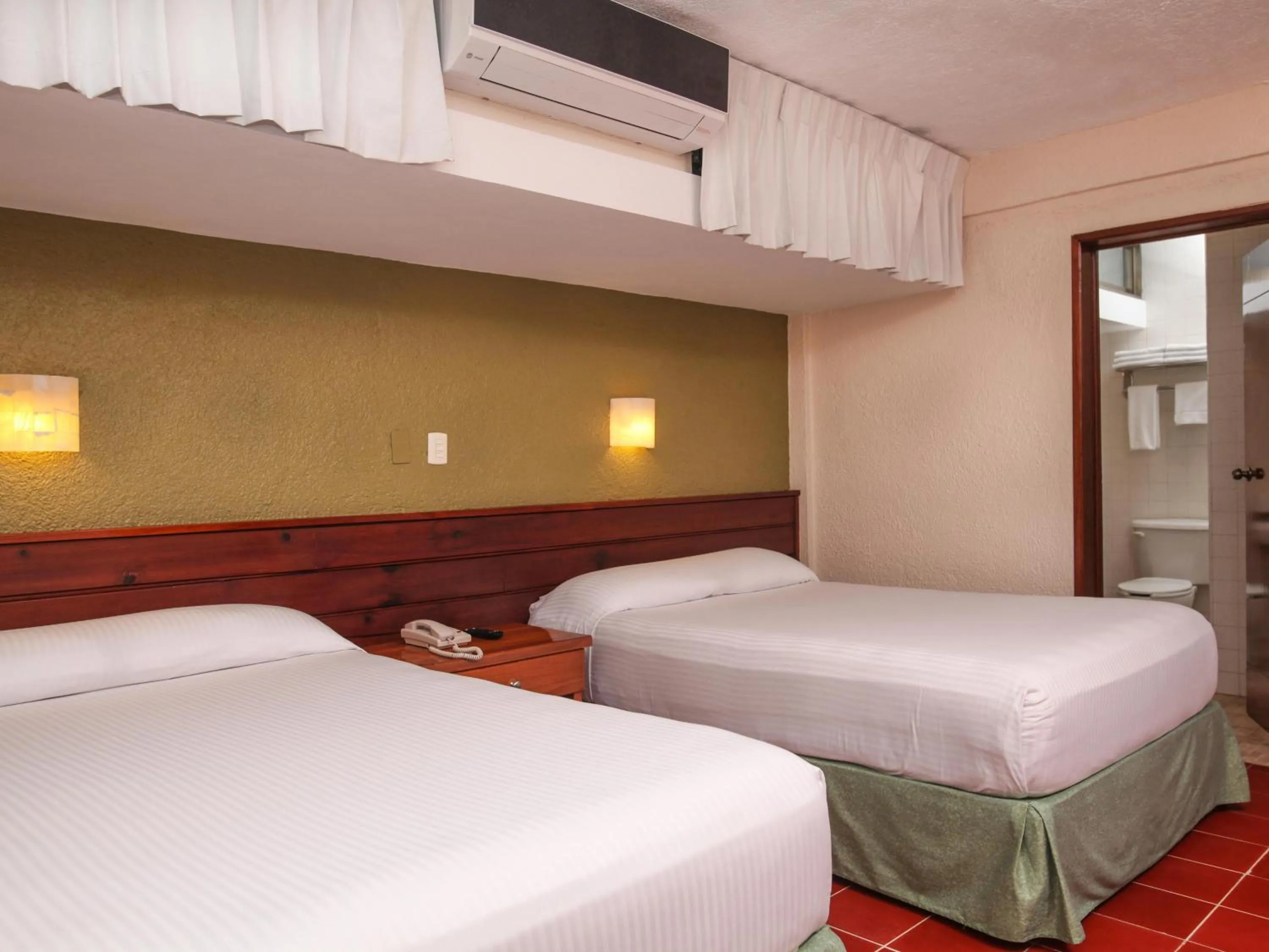 Bed in Hotel Casa Colonial Cozumel