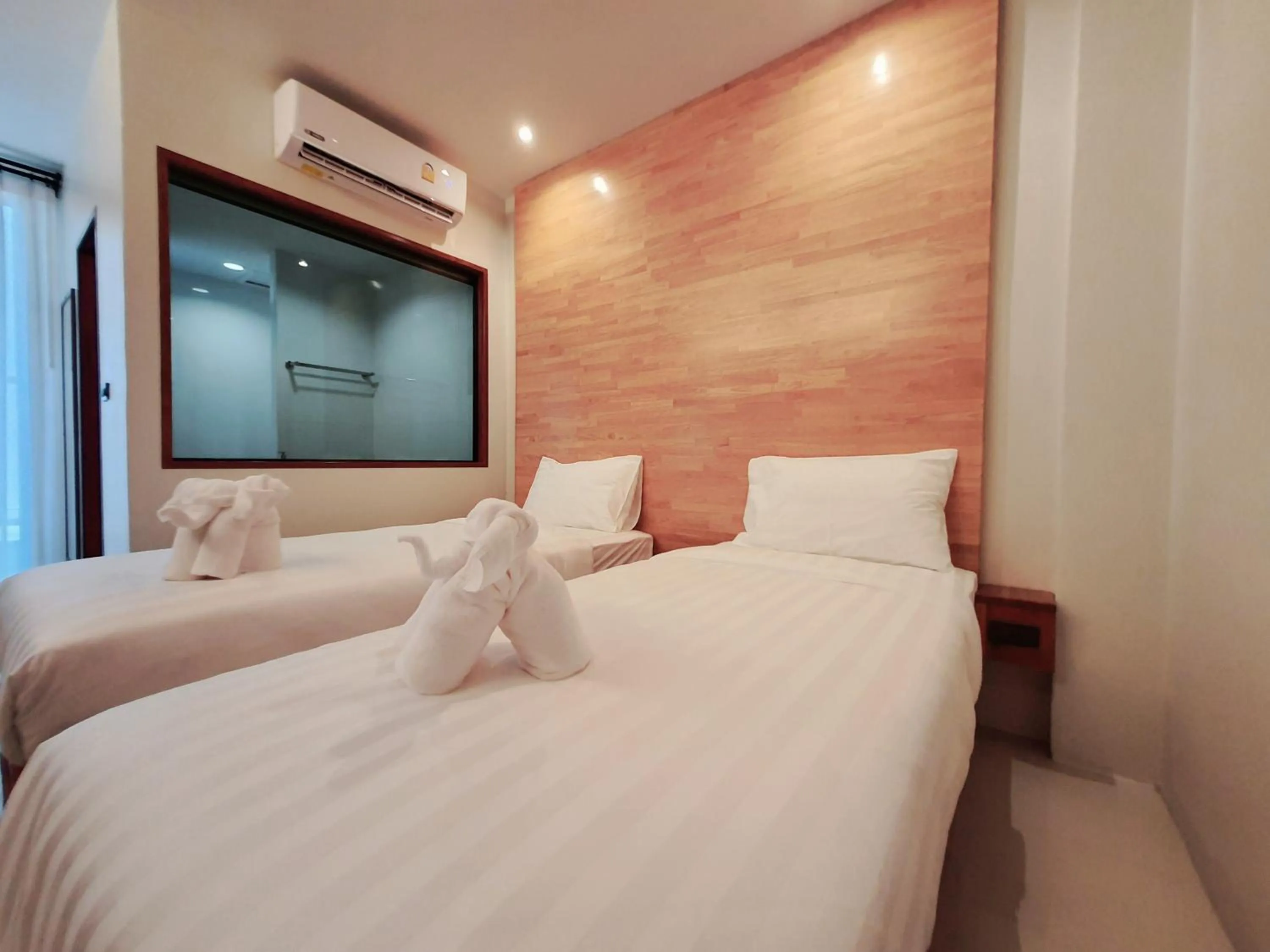 Bed in SUhotel Suratthani