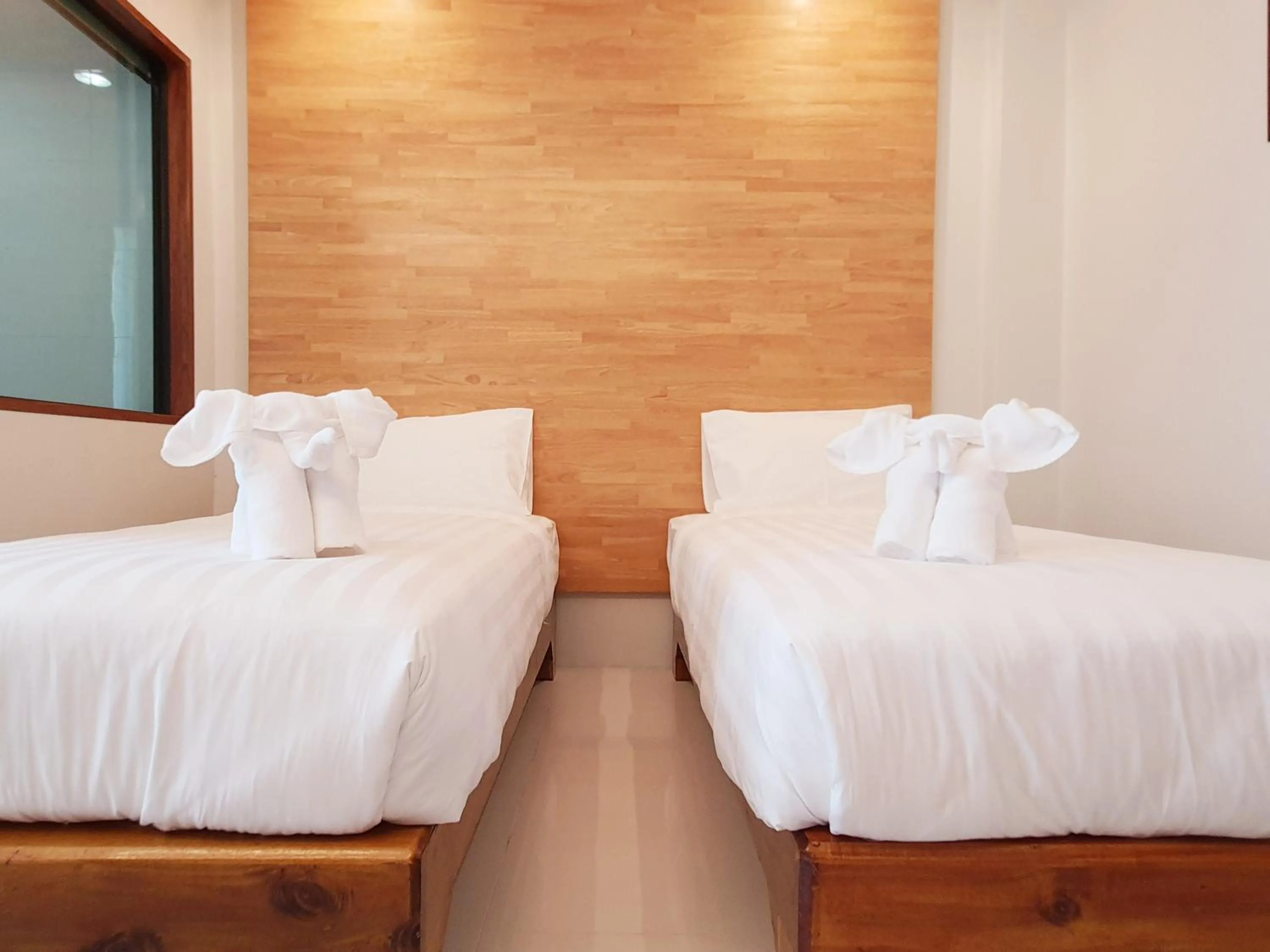 Bed in SUhotel Suratthani