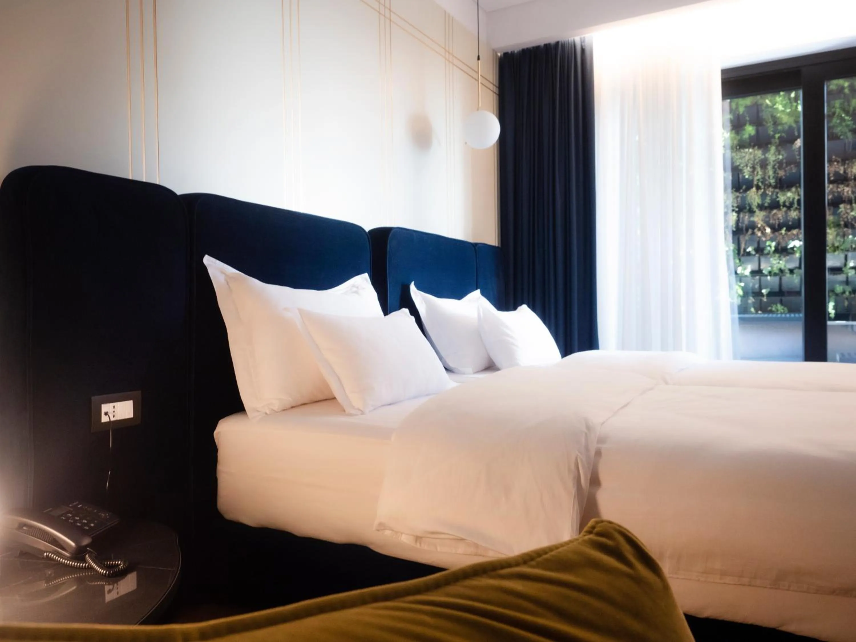 Bed in Moncafe Boutique Hotel & SPA Tirana