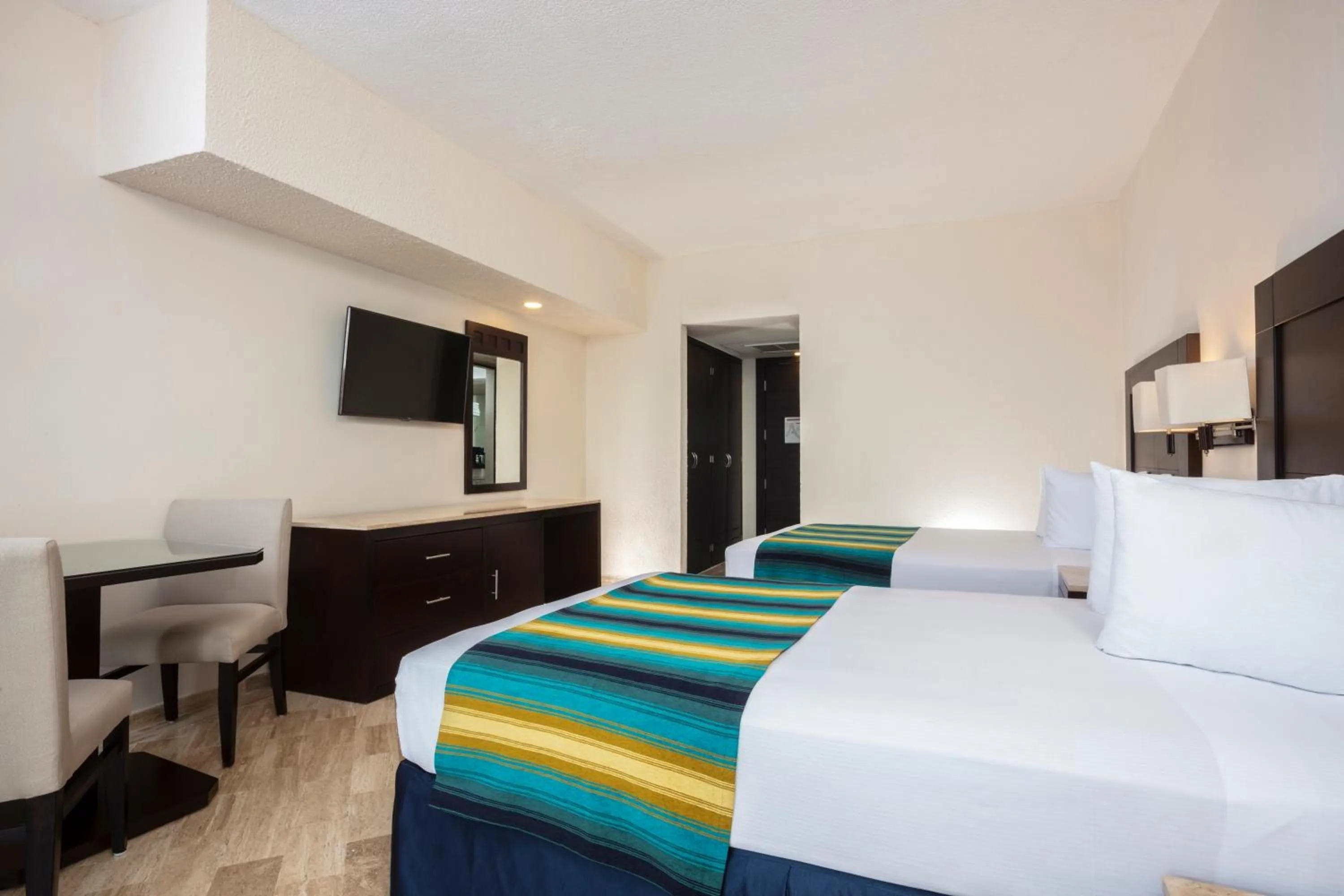 Bed in Crown Paradise Club Cancun - All Inclusive