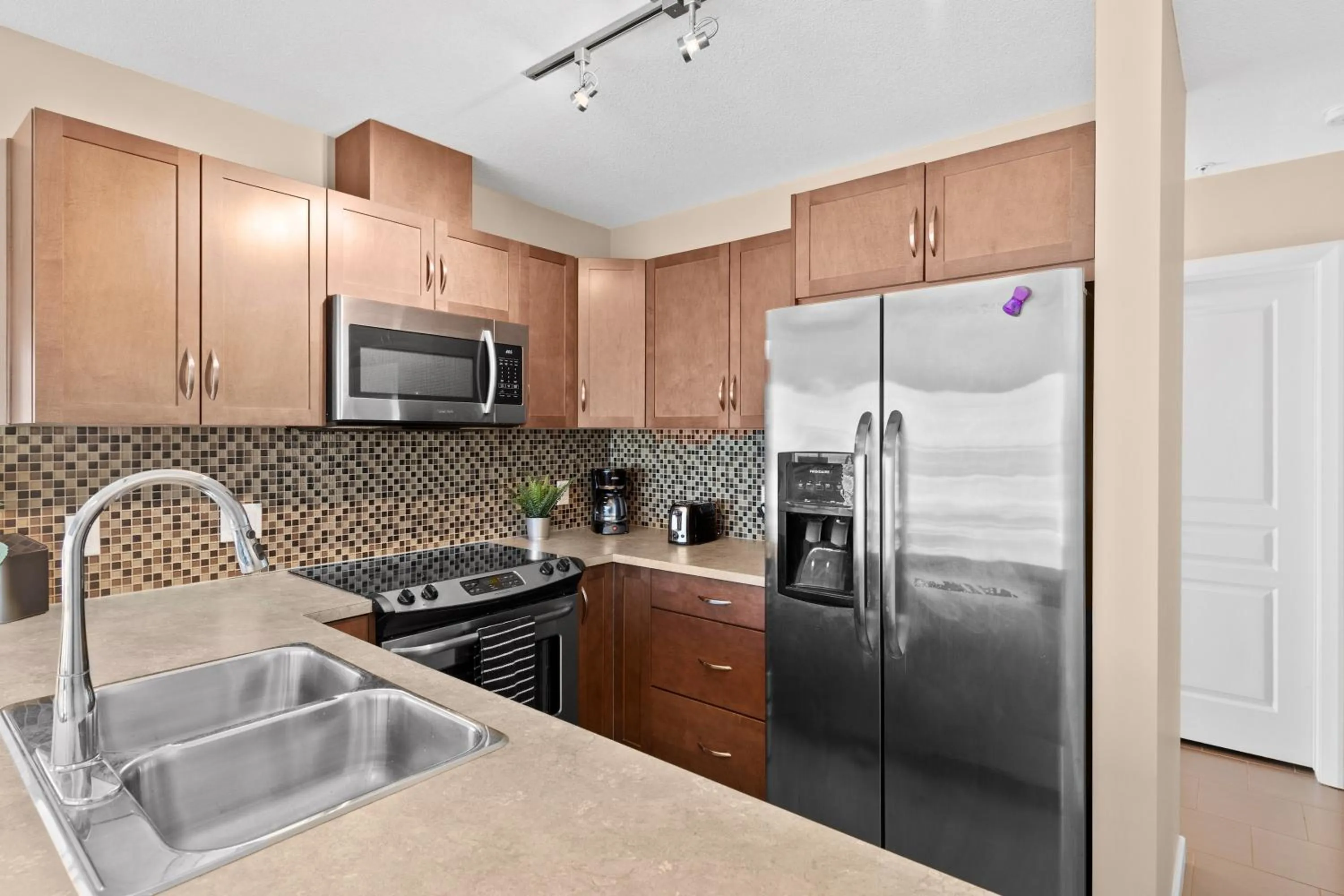 kitchen in Stylish Downtown Condos by GLOBALSTAY