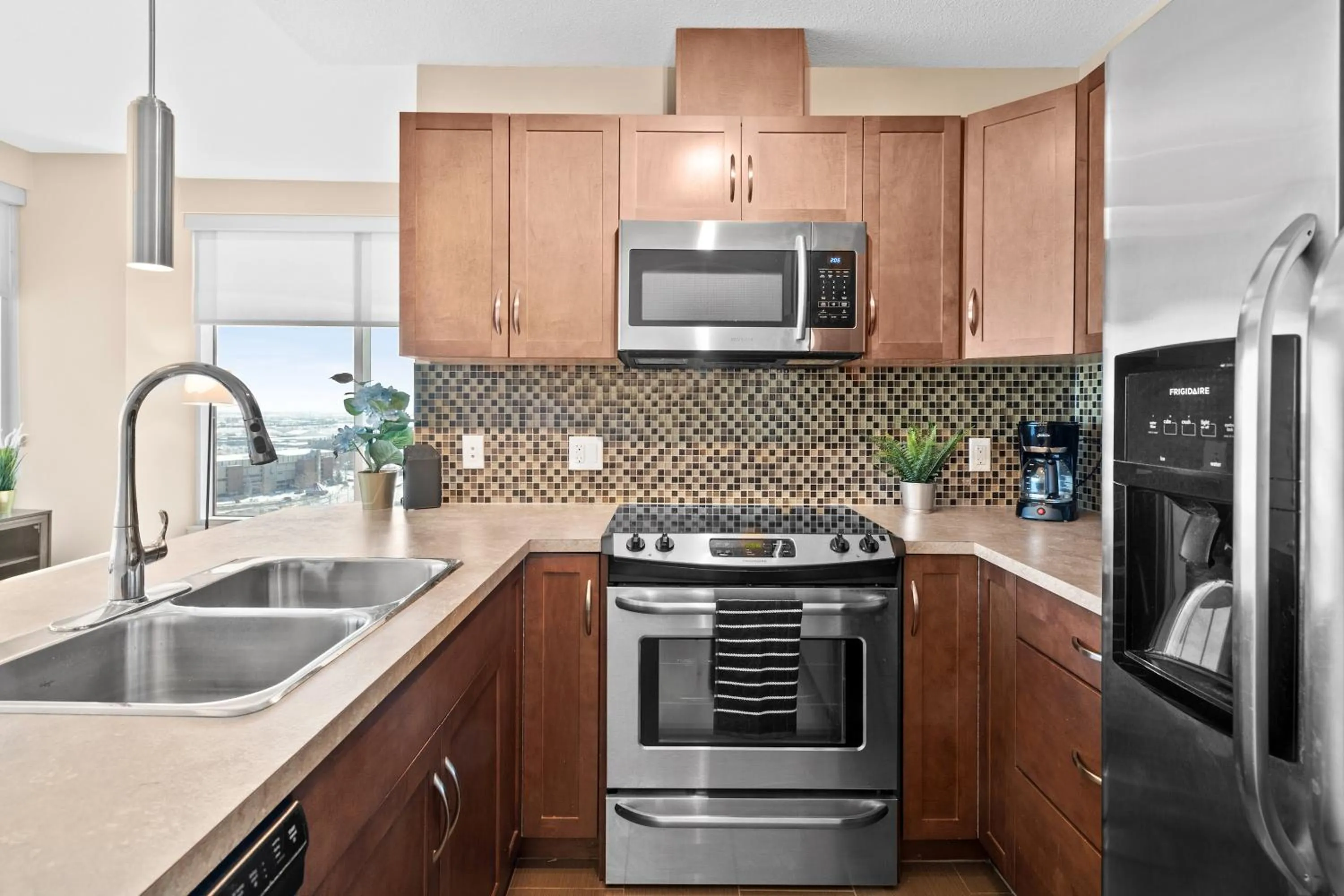 kitchen in Stylish Downtown Condos by GLOBALSTAY