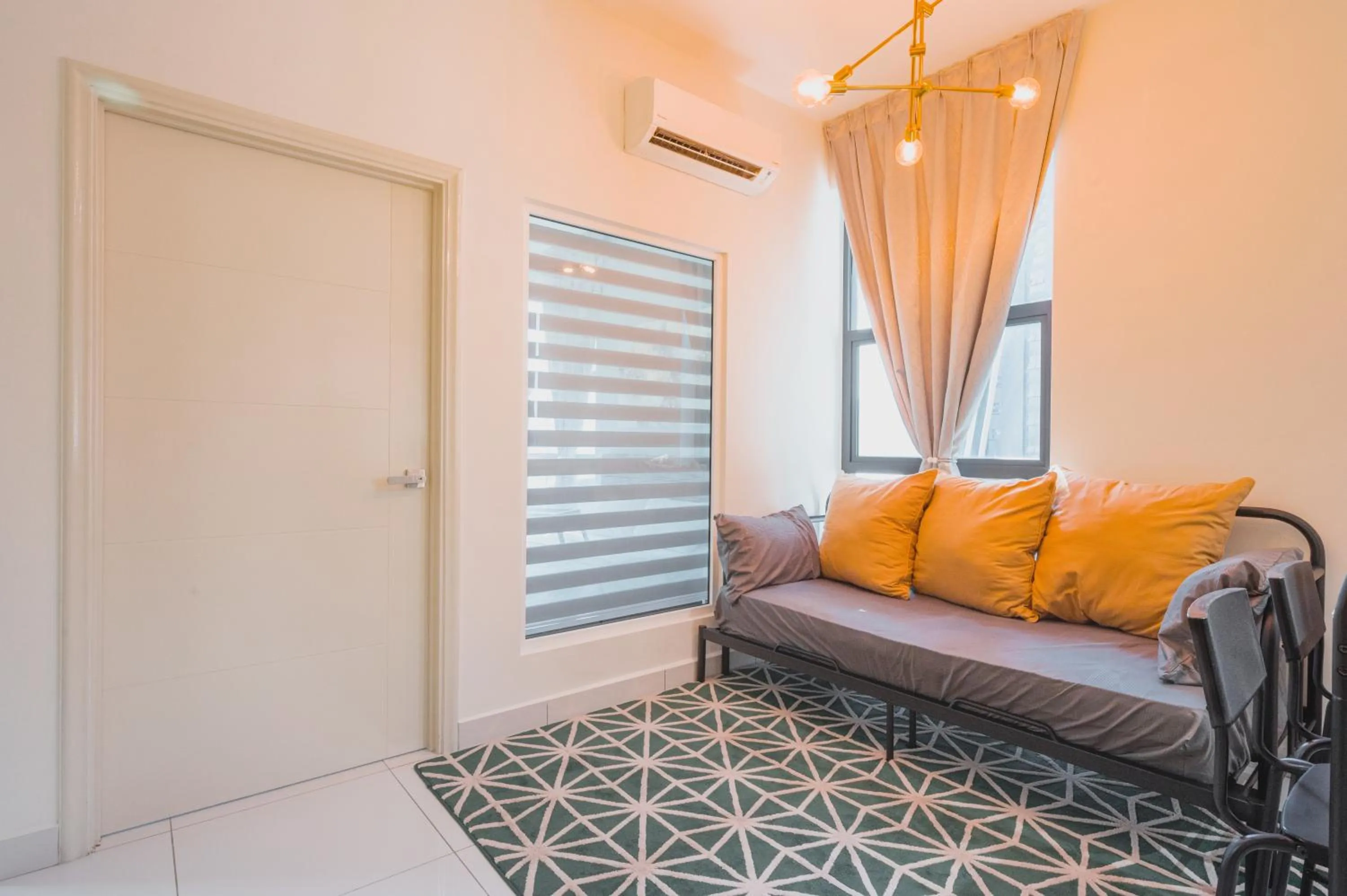 Living room, Bed in Arte Mont Kiara by Airhost