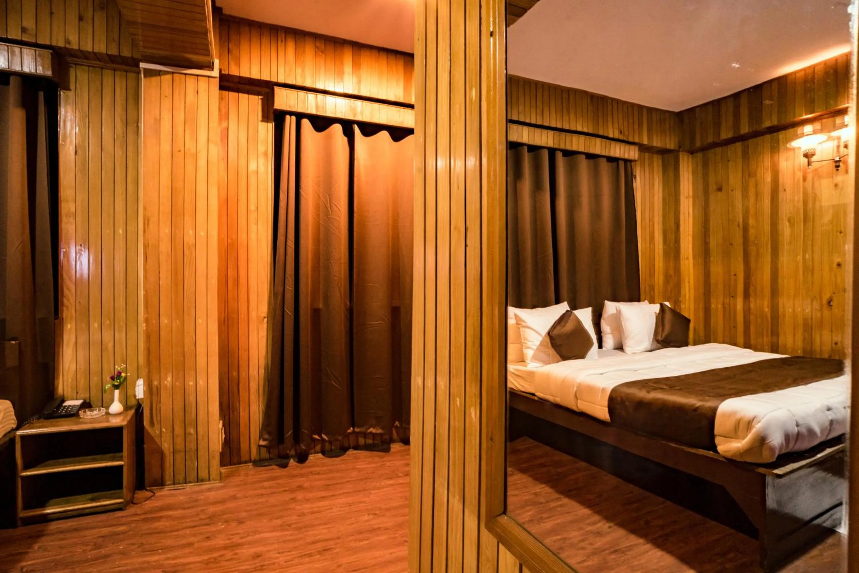 Communal lounge/ TV room in Magpie Mall Road Residency (MG Marg)