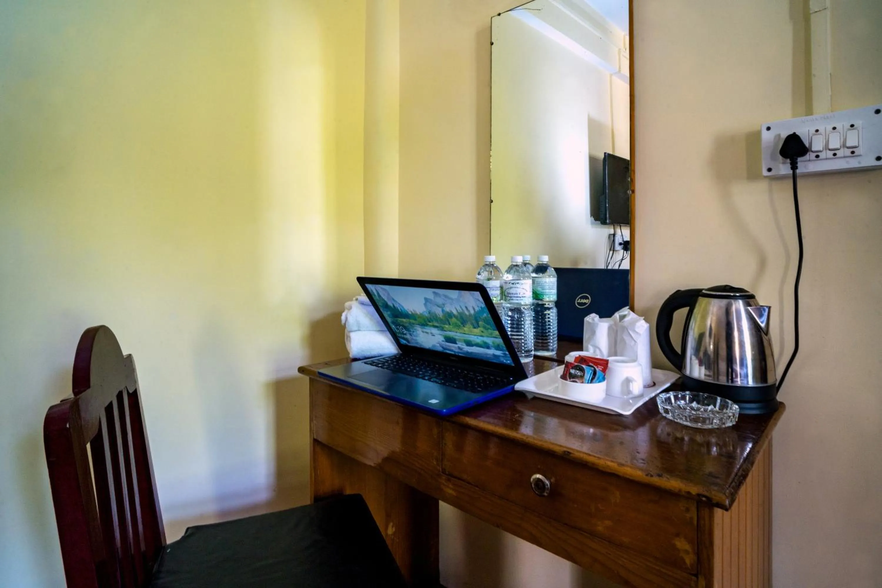 Communal lounge/ TV room in Magpie Mall Road Residency (MG Marg)