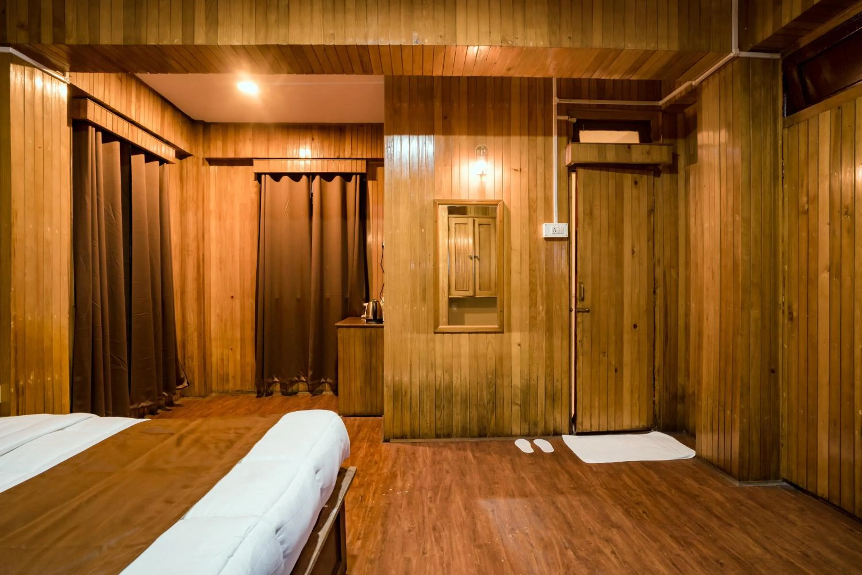 Bedroom in Magpie Mall Road Residency (MG Marg)