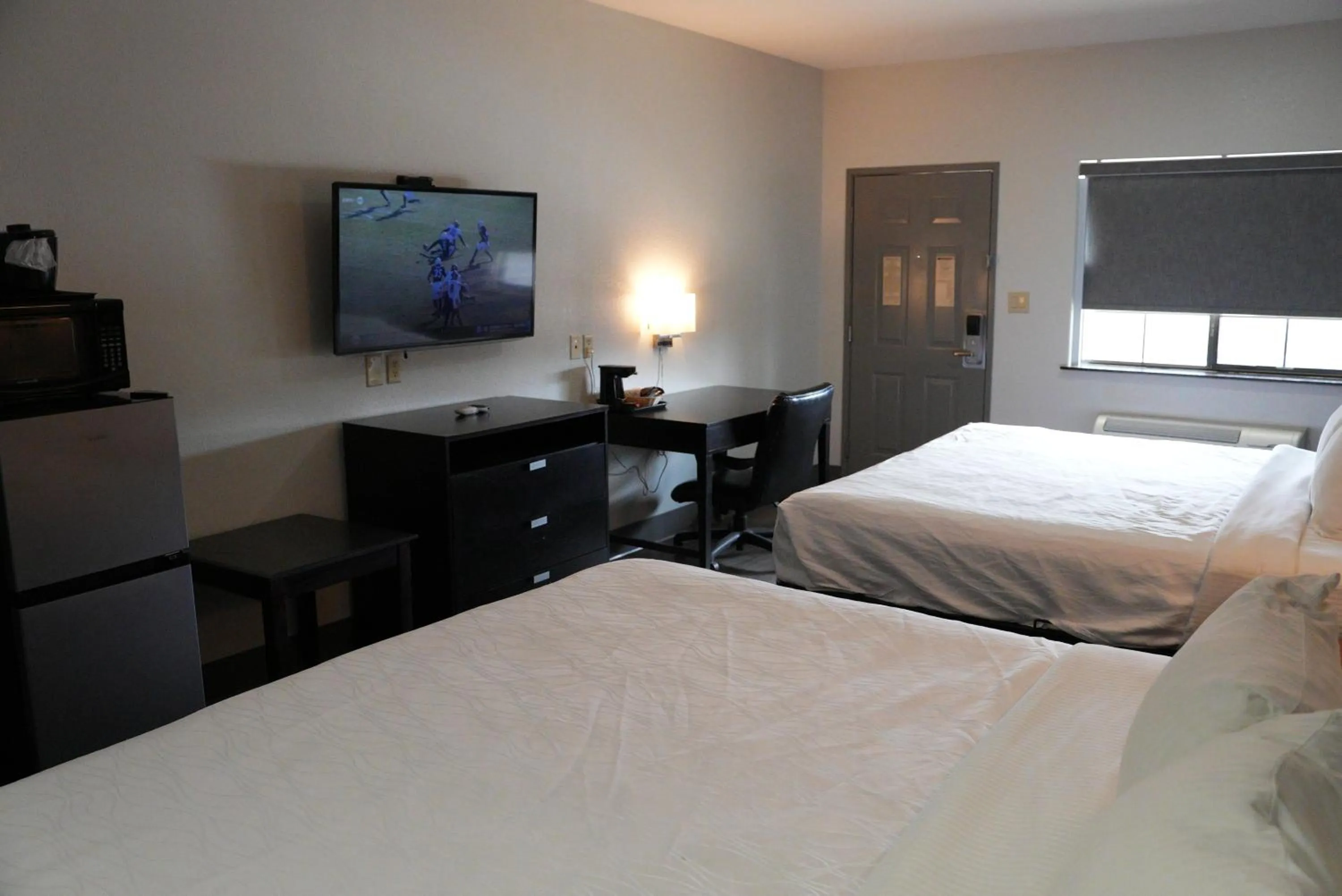 Bed in Sunbridge Inn & Suite Extended Stay