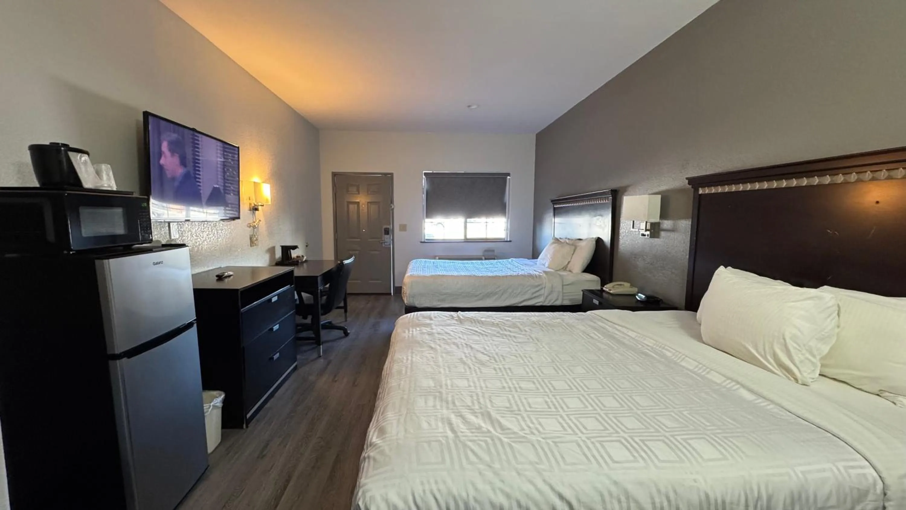 Bed in Sunbridge Inn & Suite Extended Stay