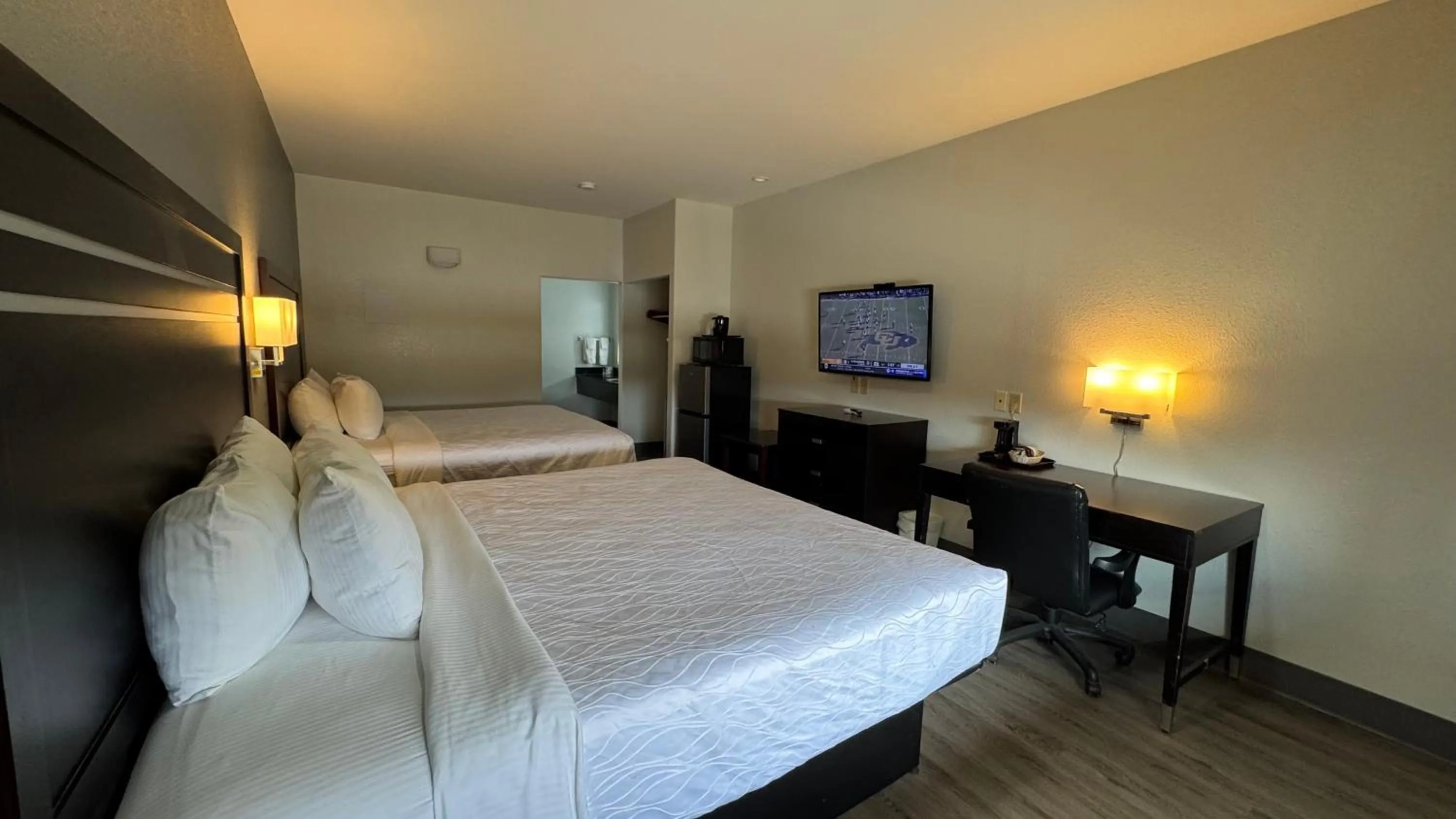 Bed in Sunbridge Inn & Suite Extended Stay