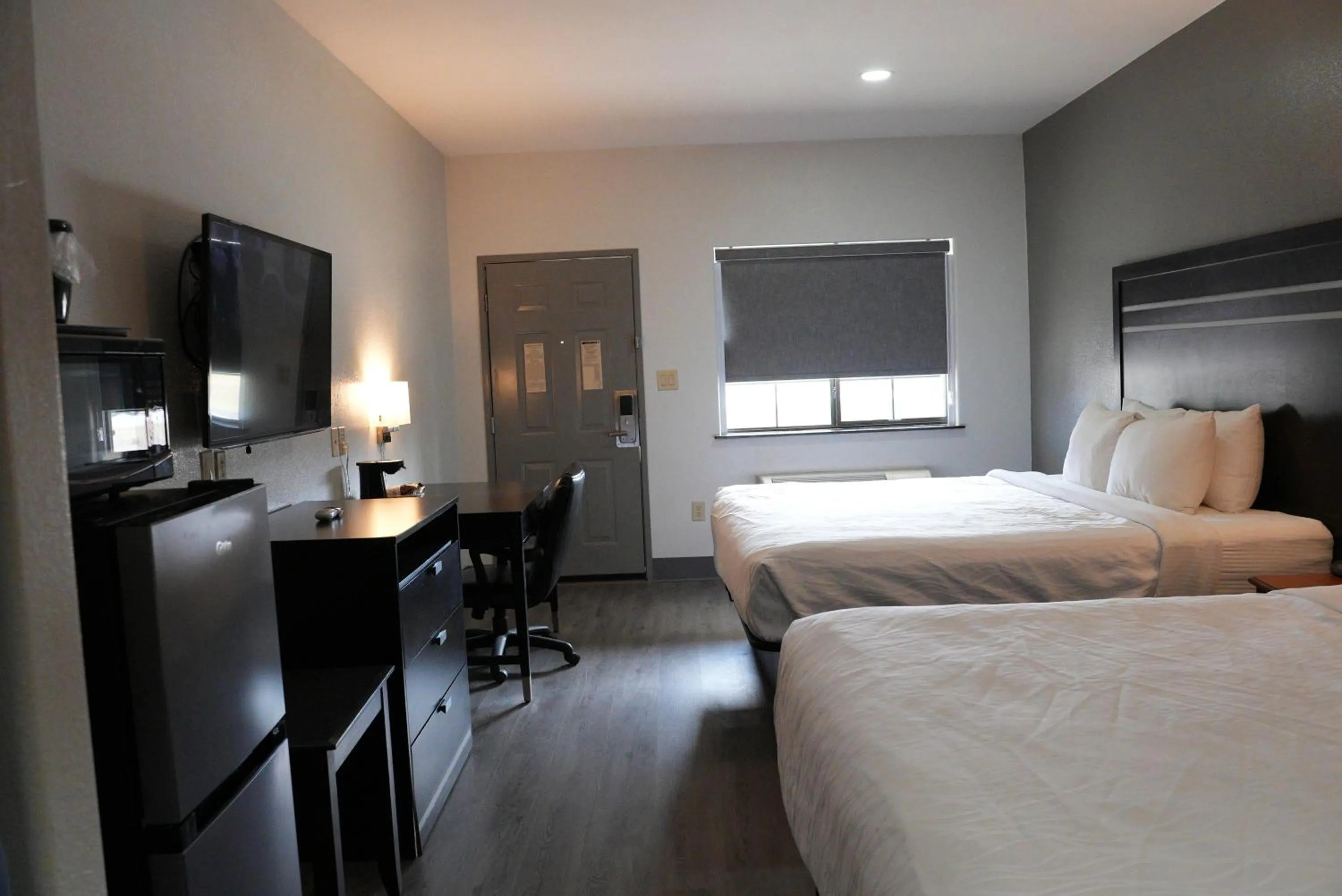 Bed in Sunbridge Inn & Suite Extended Stay