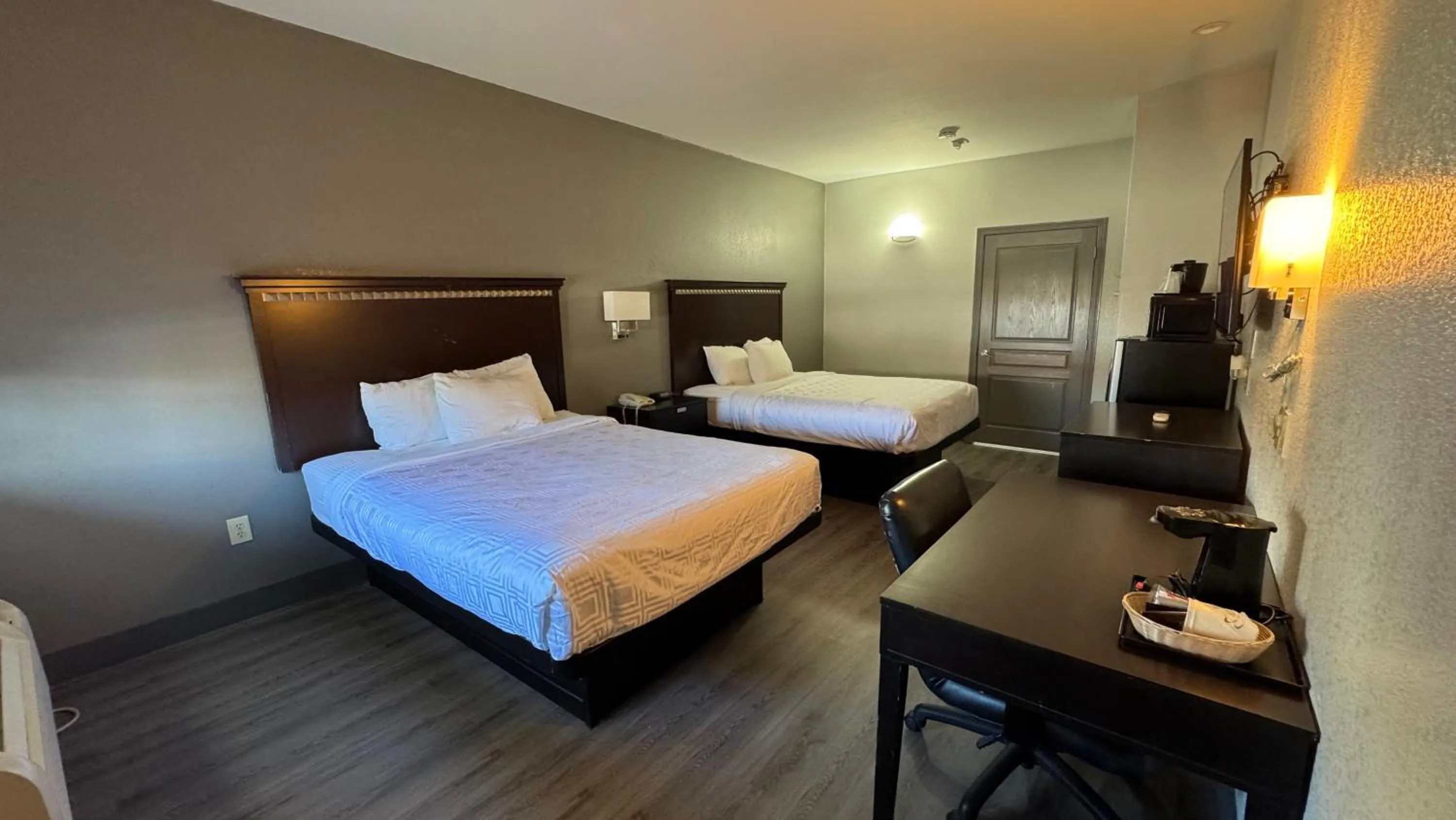 Bed in Sunbridge Inn & Suite Extended Stay