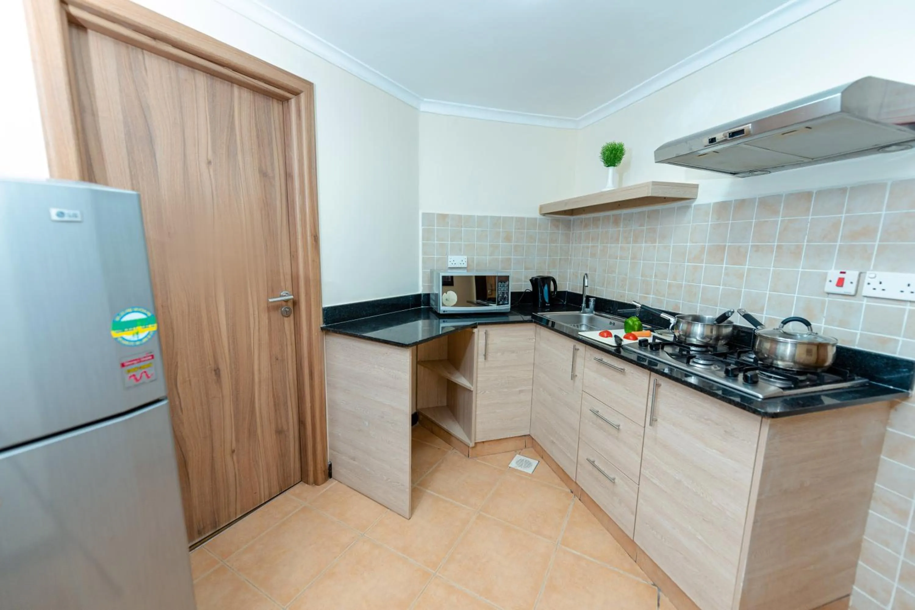 Kitchen or kitchenette in Heri Heights Hotel Apartments, SureStay Collection by Best Western