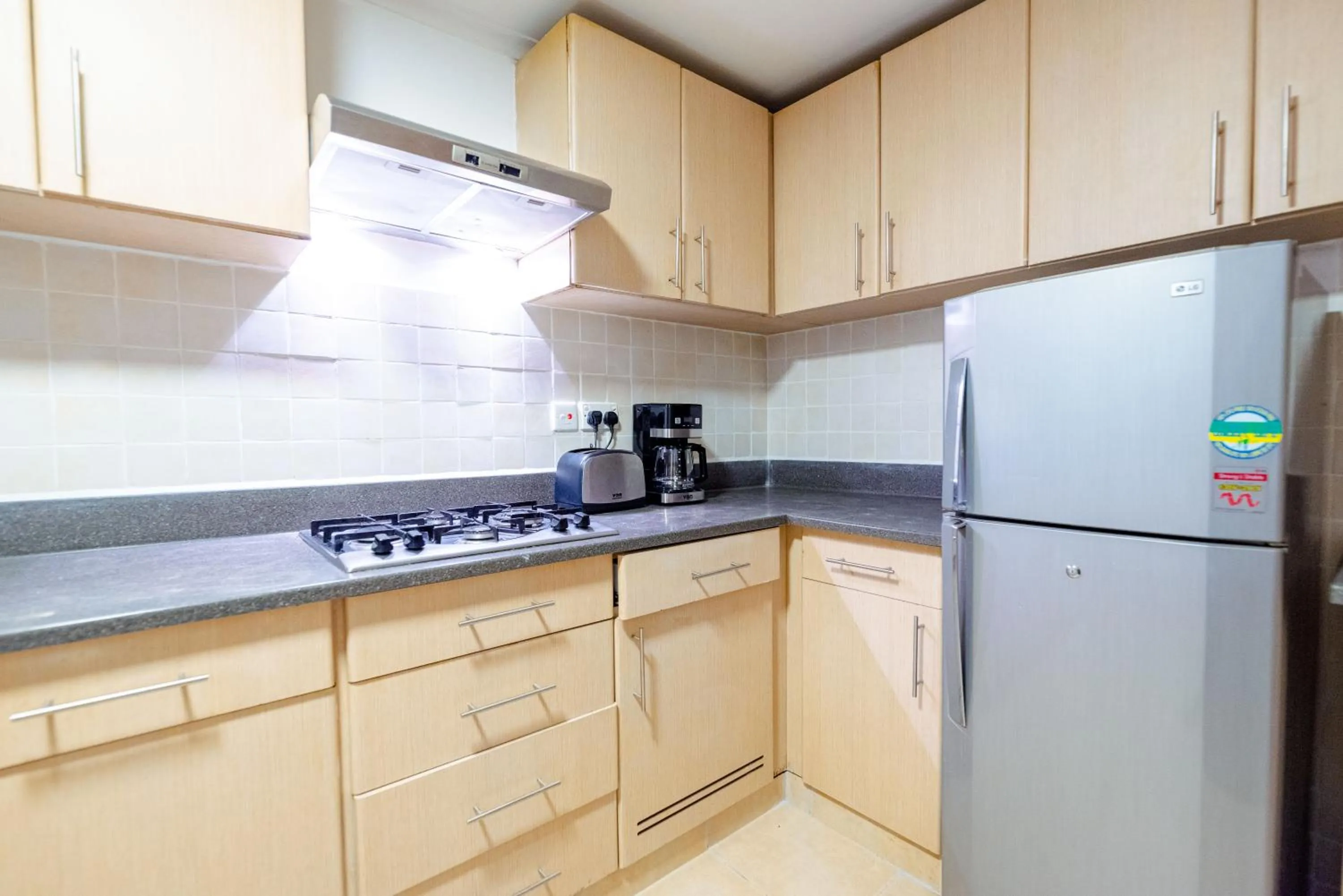 Kitchen or kitchenette in Heri Heights Hotel Apartments, SureStay Collection by Best Western