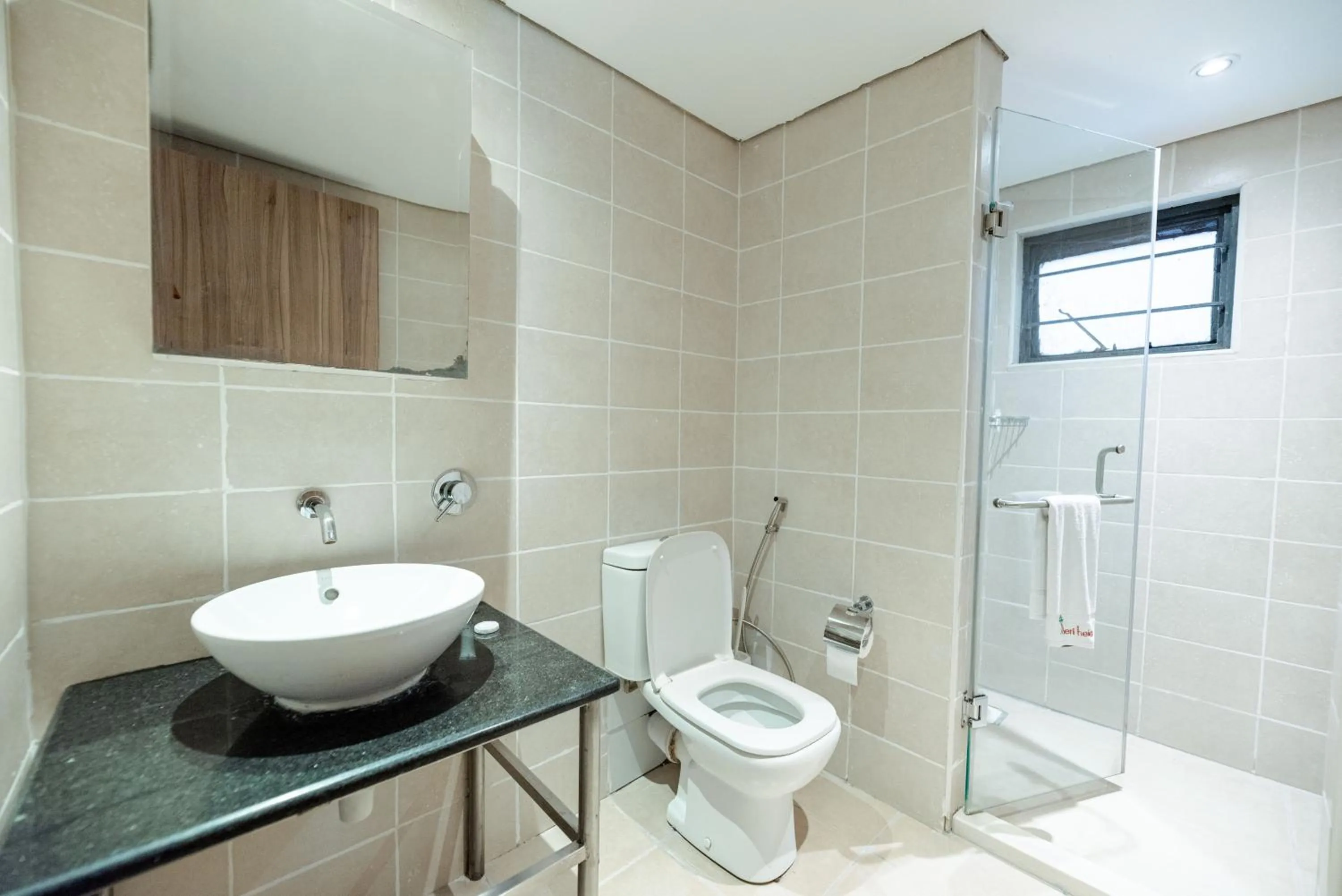 Bathroom in Heri Heights Hotel Apartments, SureStay Collection by Best Western