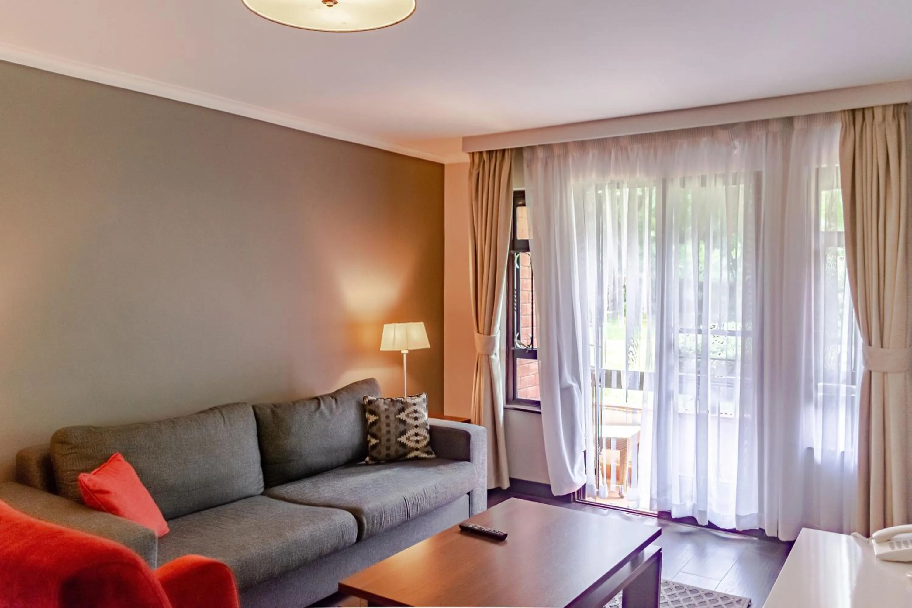 Living room in Heri Heights Hotel Apartments, SureStay Collection by Best Western